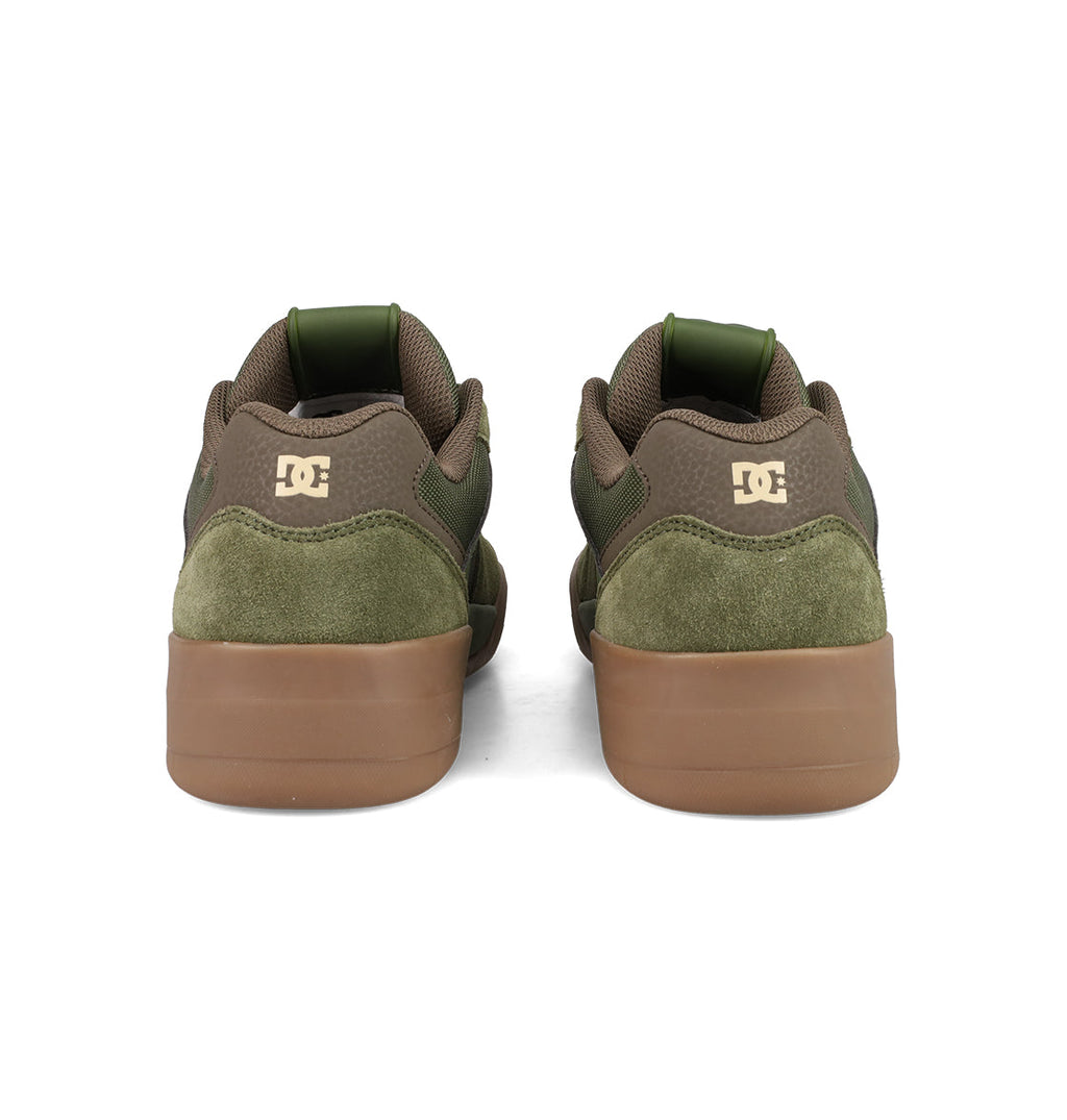 Men's Fractal Shoes by DC Shoes in green and brown, shown from the back with suede details, tan rubber soles, and a white DC logo on the heel for street-ready style.