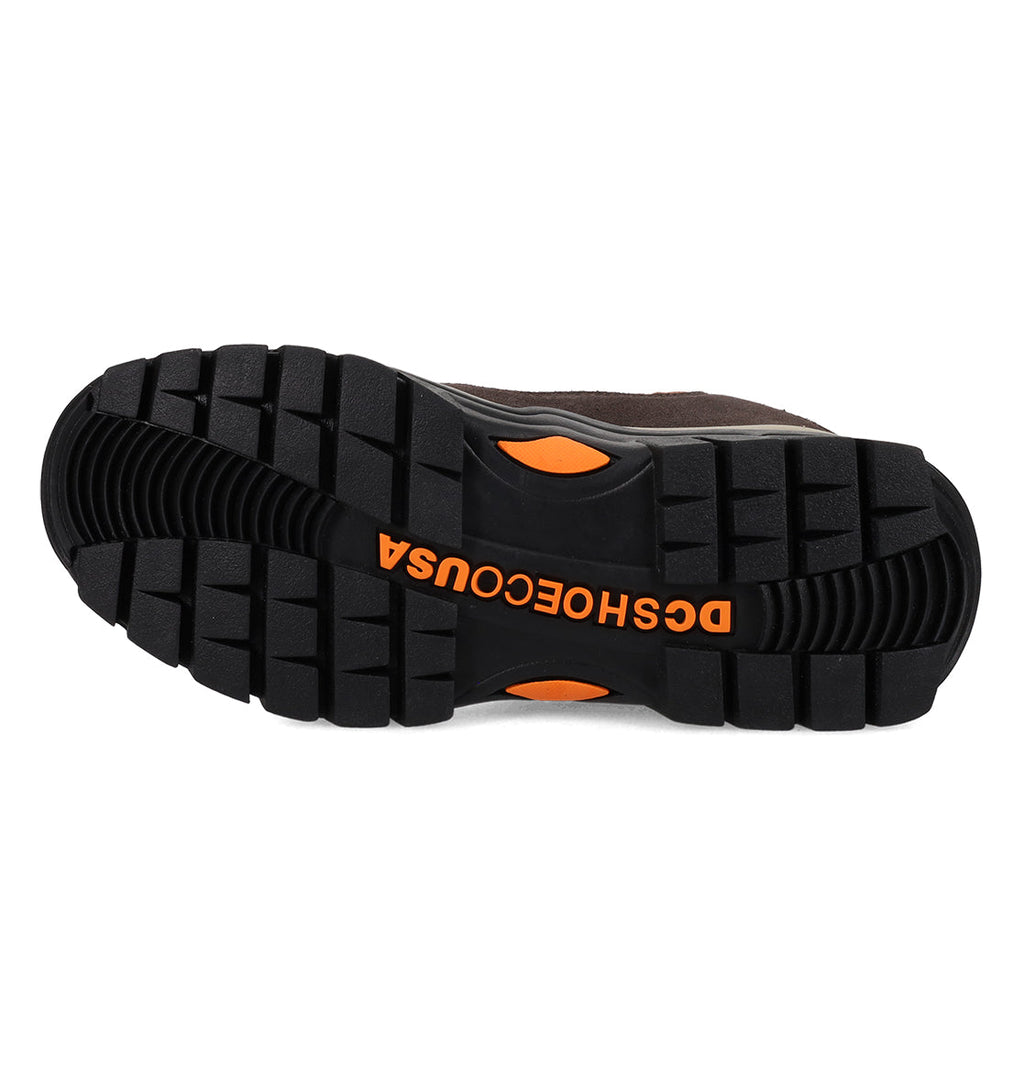 The black rubber sole of the Men’s Recon OG Shoes by DC Shoes is displayed, featuring an orange logo text reading DSCHOECOUSA across the arch. Engineered for durability, the tread boasts deep grooves and orange accents, delivering reliable traction and weather resistance for any adventure.