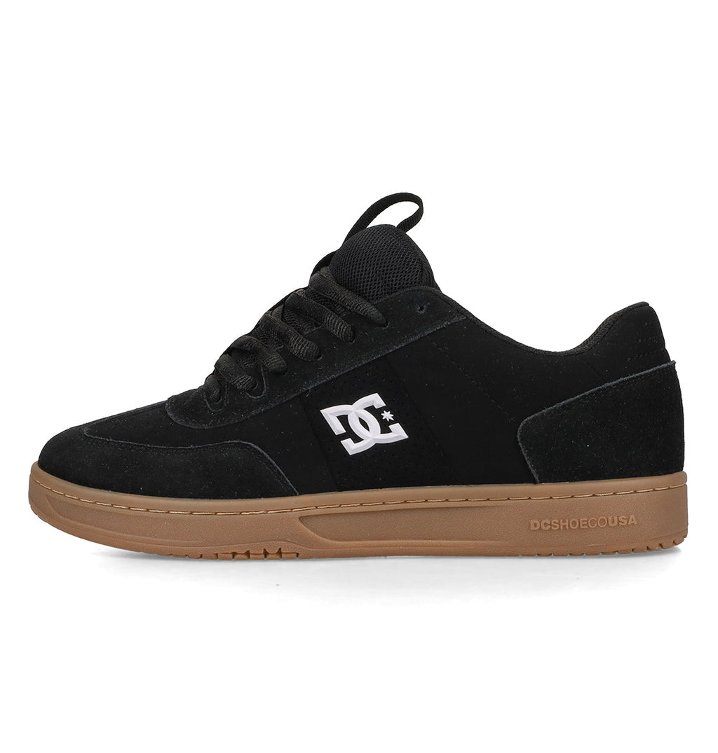 The Men’s Astrix Shoes by DC Shoes are black skate shoes engineered for excellent board control, featuring a brown sole, black laces, and the signature DC Shoes logo in white on the side. “DCSHOECOUSA” is embossed near the heel of the sole, making them perfect for street skateboarding sessions.