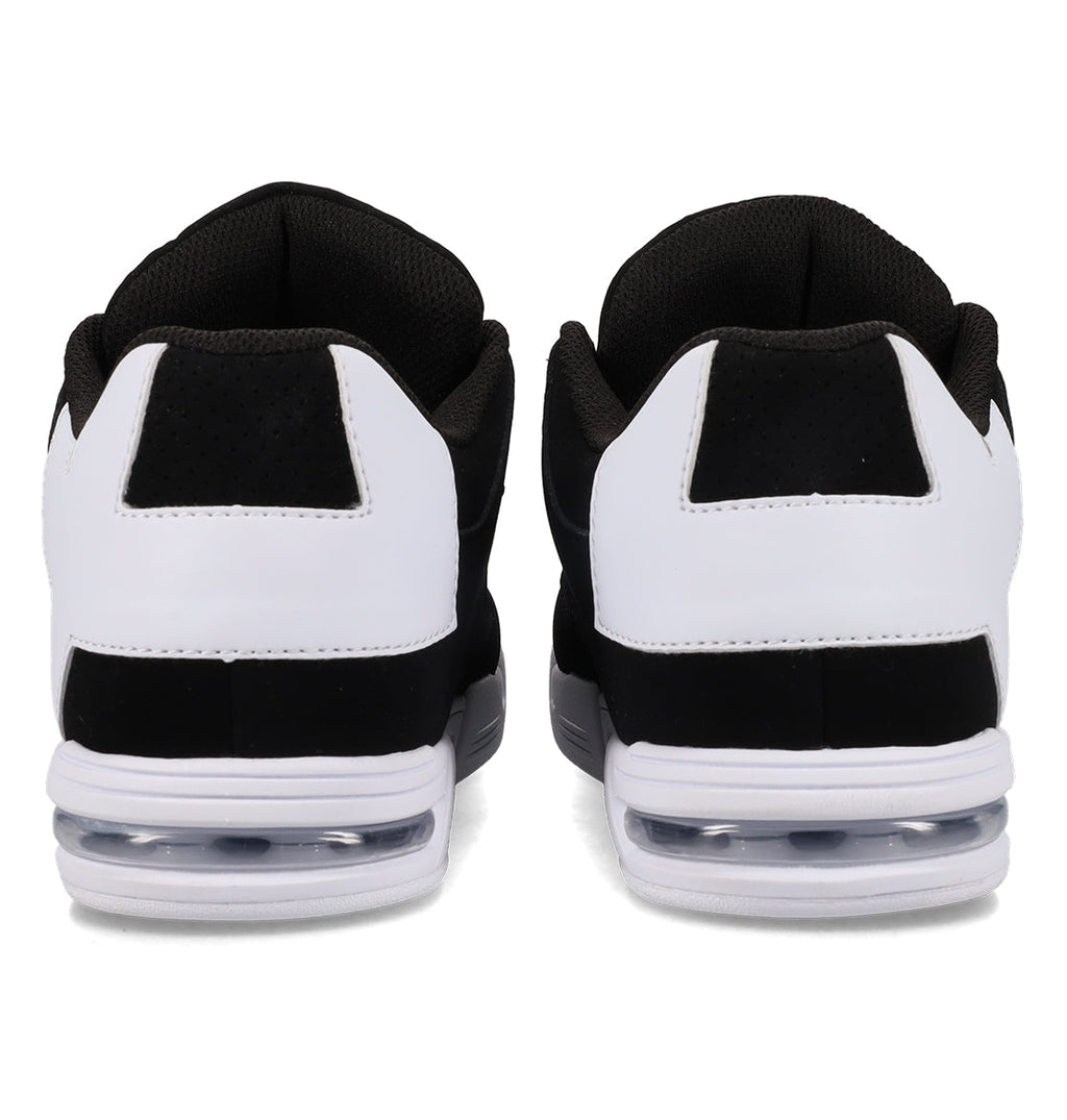 A pair of DC Shoes Women’s Command Shoes in black and white are shown from the back, highlighting the heel, black interior lining, white outer panels, and visible air cushions in the soles. These sneakers exude old-school energy with their signature cushioning—delivering both retro style and comfort.