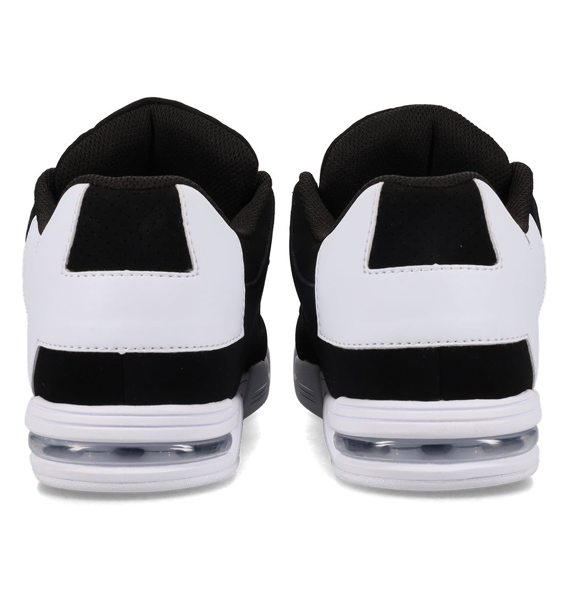A pair of DC Shoes Women’s Command Shoes in black and white are shown from the back, highlighting the heel, black interior lining, white outer panels, and visible air cushions in the soles. These sneakers exude old-school energy with their signature cushioning—delivering both retro style and comfort.