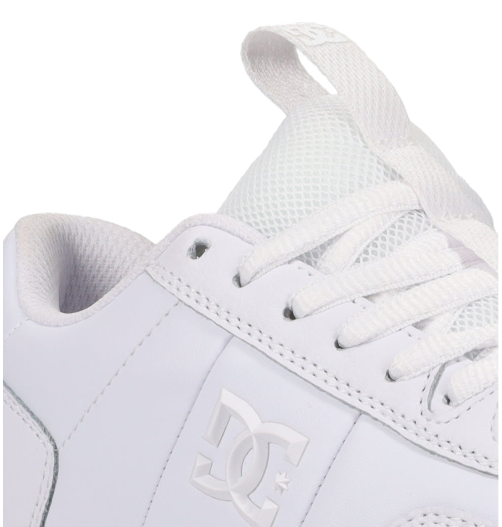 Close-up of the Women’s Astrix Shoes from DC Shoes—a white skate shoe featuring white laces, mesh tongue, and the iconic DC Shoes logo embossed on the side—crafted for superior board control during street skateboarding.