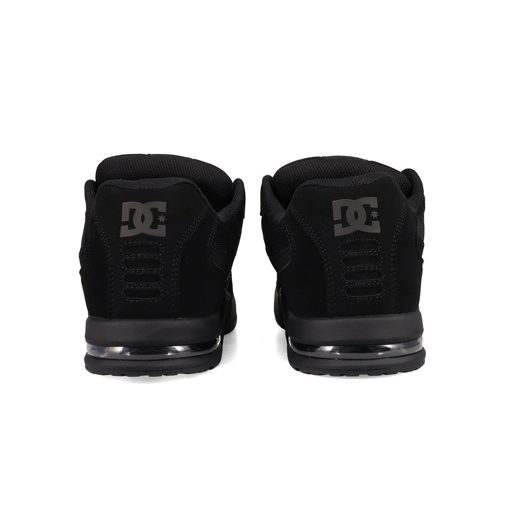 The Men's AT-2 Shoes by DC Shoes are shown from the back, with gray DC logos on each heel, a black sole featuring an airband outsole, and a padded collar.
