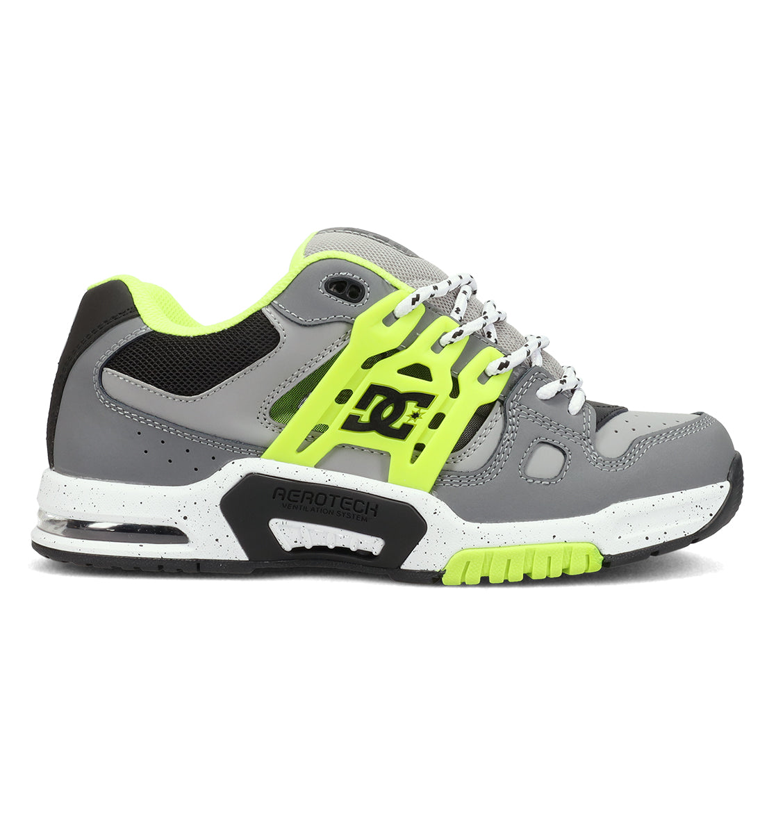 The DC Shoes Men's AT-2 features a gray and neon yellow design with black and white accents, thick sole, mesh panels, side DC logo, supportive TPU cage for stability, perforations for breathability, and a lace-up closure.