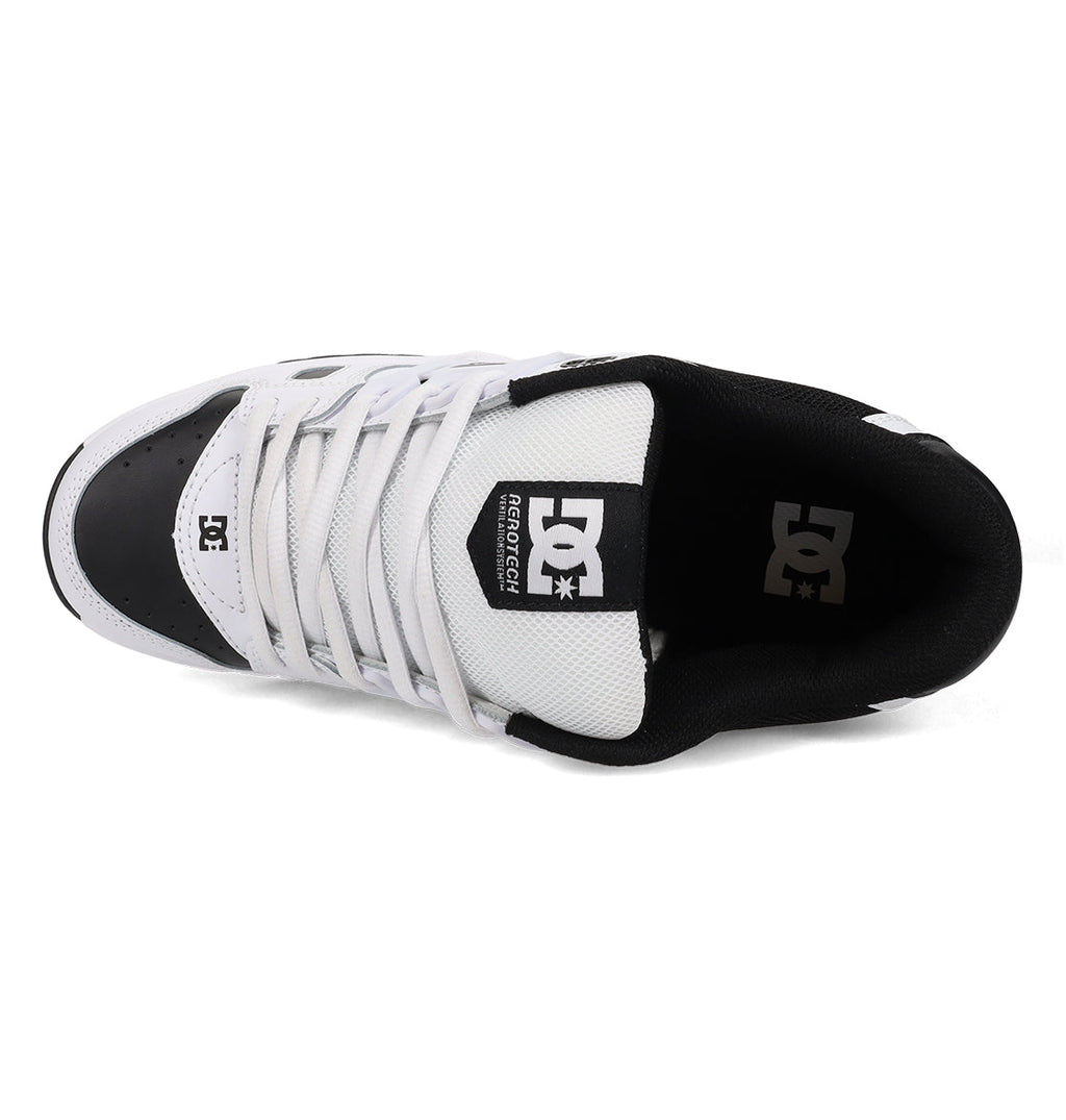 Top view of the Men’s AT-2 Shoes by DC Shoes in white and black, featuring white laces, mesh fabric, the DC Shoes logo on the tongue, and an airband outsole designed for enhanced grip and durability.