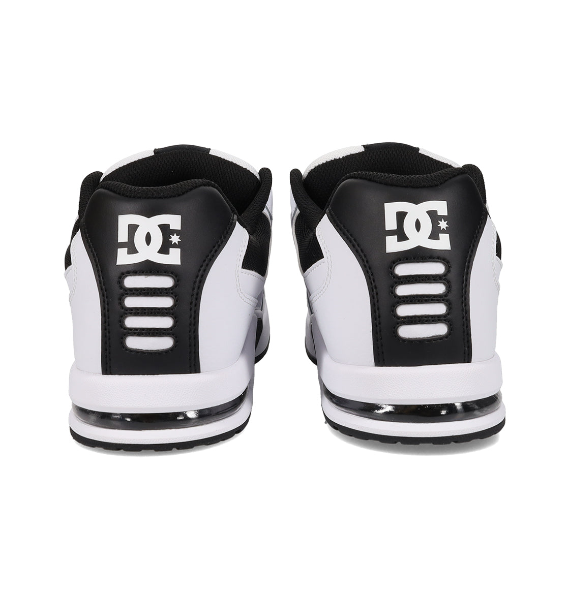 Rear view of a pair of DC Shoes Men’s AT-2 shoes in white and black, featuring the DC logo on the heel counter and horizontal AEROTECH ventilation slots above a cushioned sole.