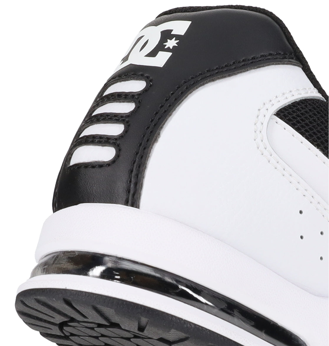Close-up of the heel of the Men’s AT-2 Shoes by DC Shoes, showcasing a black and white design with the iconic DC logo on the back. The shoe features a white sole with black tread and incorporates an airband outsole for enhanced cushioning, providing both comfort and performance.