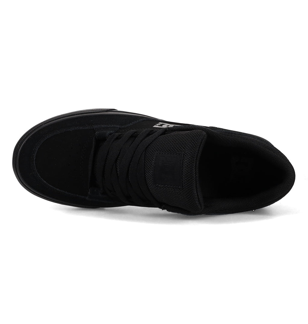 Introducing the Men’s Onyx Shoes by DC Shoes—seen from above, the sleek black sneaker showcases its laces, tongue, and toe area, highlighting a minimal silhouette that makes it an essential choice for everyday wear.