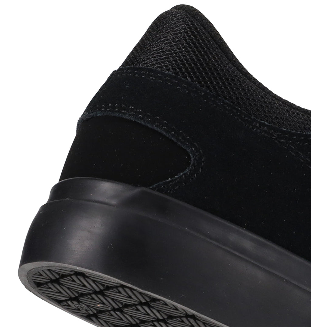 Close-up of the heel and outsole of the DC Shoes Men’s Onyx Shoes, highlighting its minimal silhouette with a textured sole, suede detailing, and mesh fabric on the upper—a versatile everyday vulc sneaker.