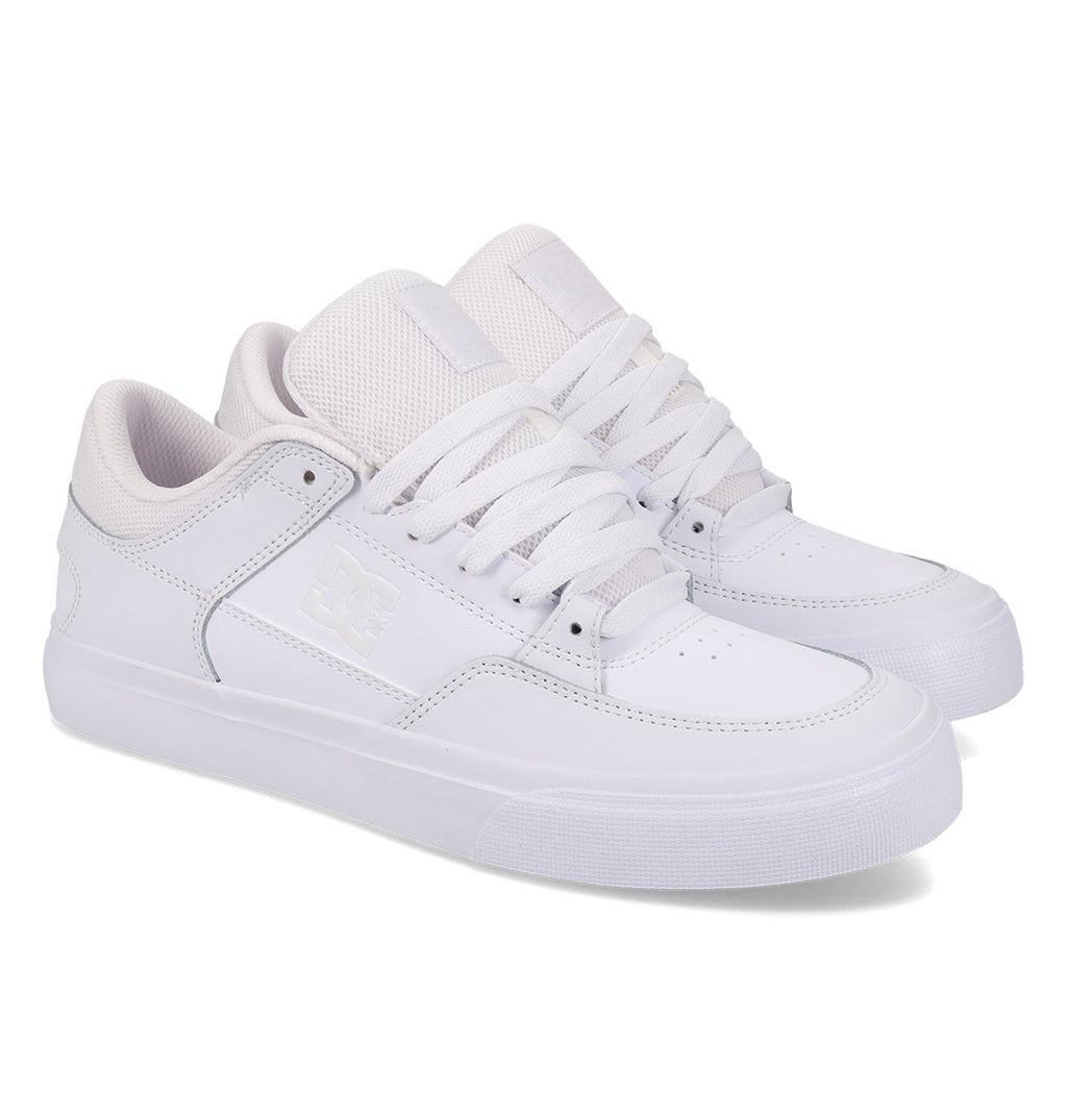 A pair of DC Shoes Men’s Onyx low-top sneakers in white, featuring laces, mesh tongues, and understated branding on the side and tongue—your everyday go-to—displayed side by side against a plain white background.
