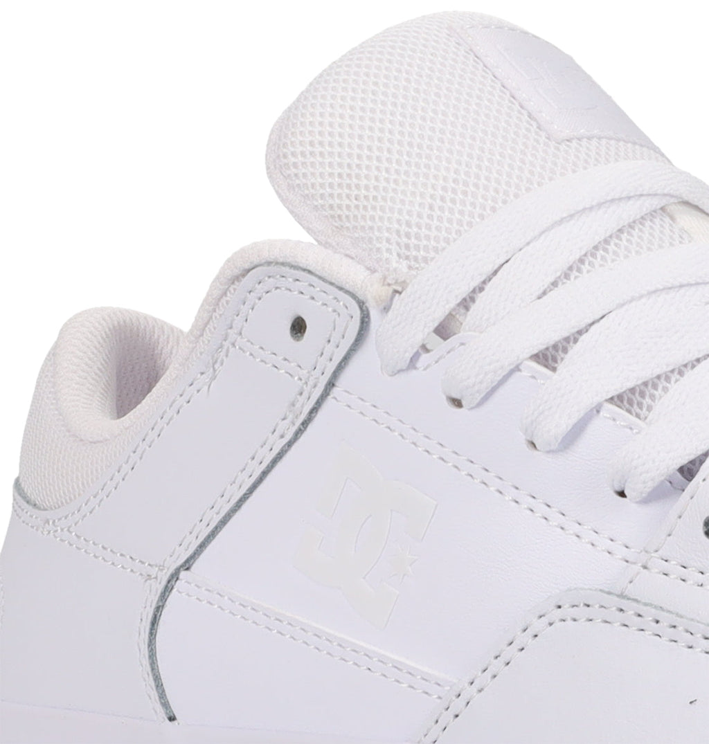 Close-up of a white Men’s Onyx Shoe by DC Shoes, an everyday vulc sneaker, highlighting the side logo, textured laces, and a padded mesh-detailed tongue.