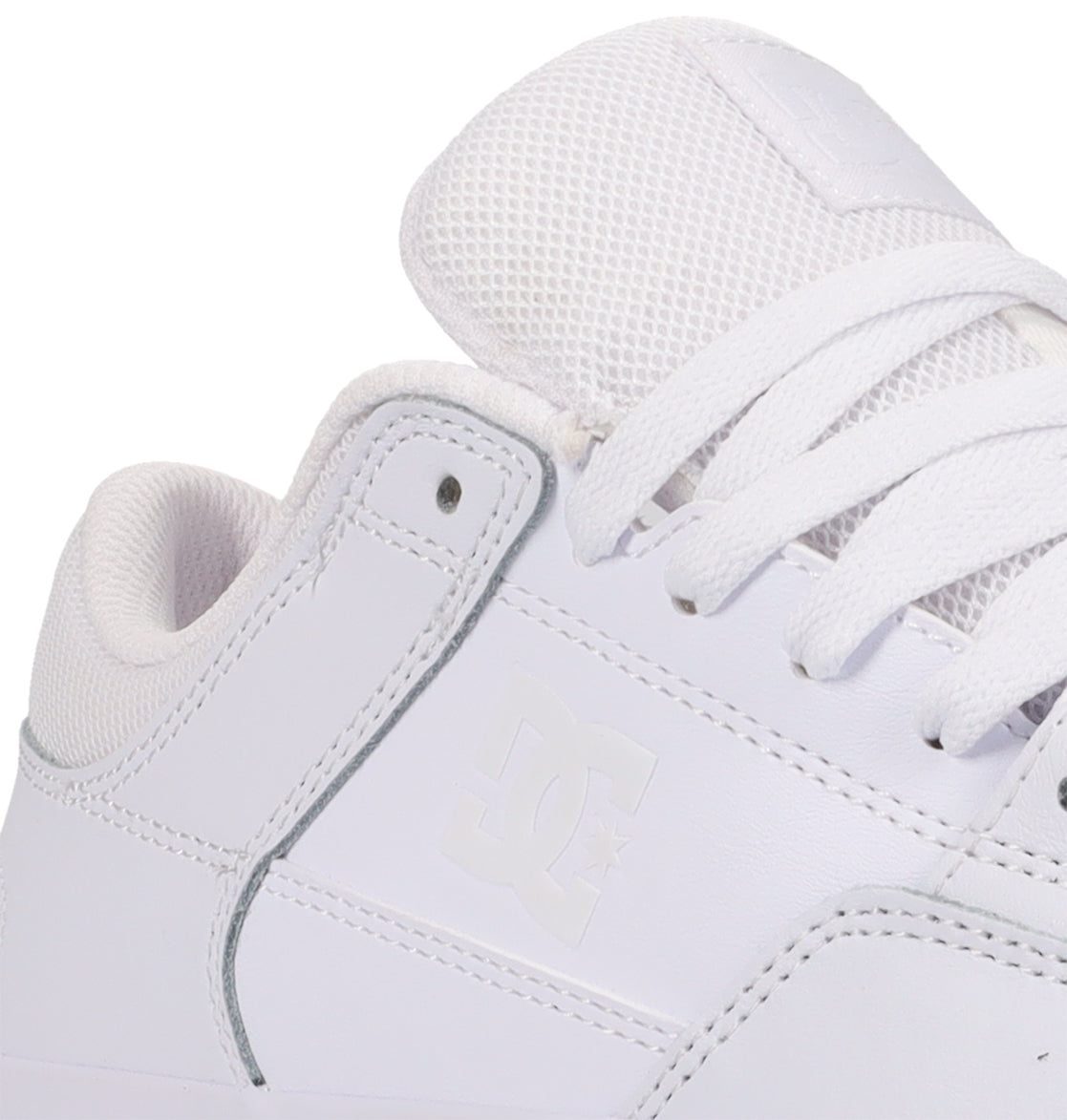 Close-up of a white Men’s Onyx Shoe by DC Shoes, an everyday vulc sneaker, highlighting the side logo, textured laces, and a padded mesh-detailed tongue.