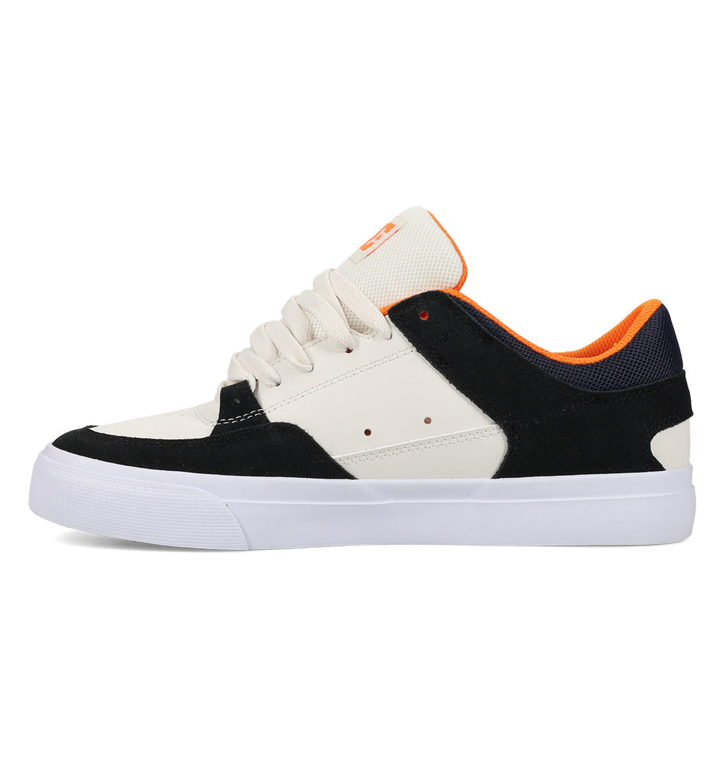 The Men’s Onyx Skate Shoes by DC Shoes feature a low-top vulcanized design with white laces, a white sole, beige and black panels, and an orange inner lining. Shown in a side view facing left, these shoes offer a minimal silhouette—making them the perfect everyday go-to.