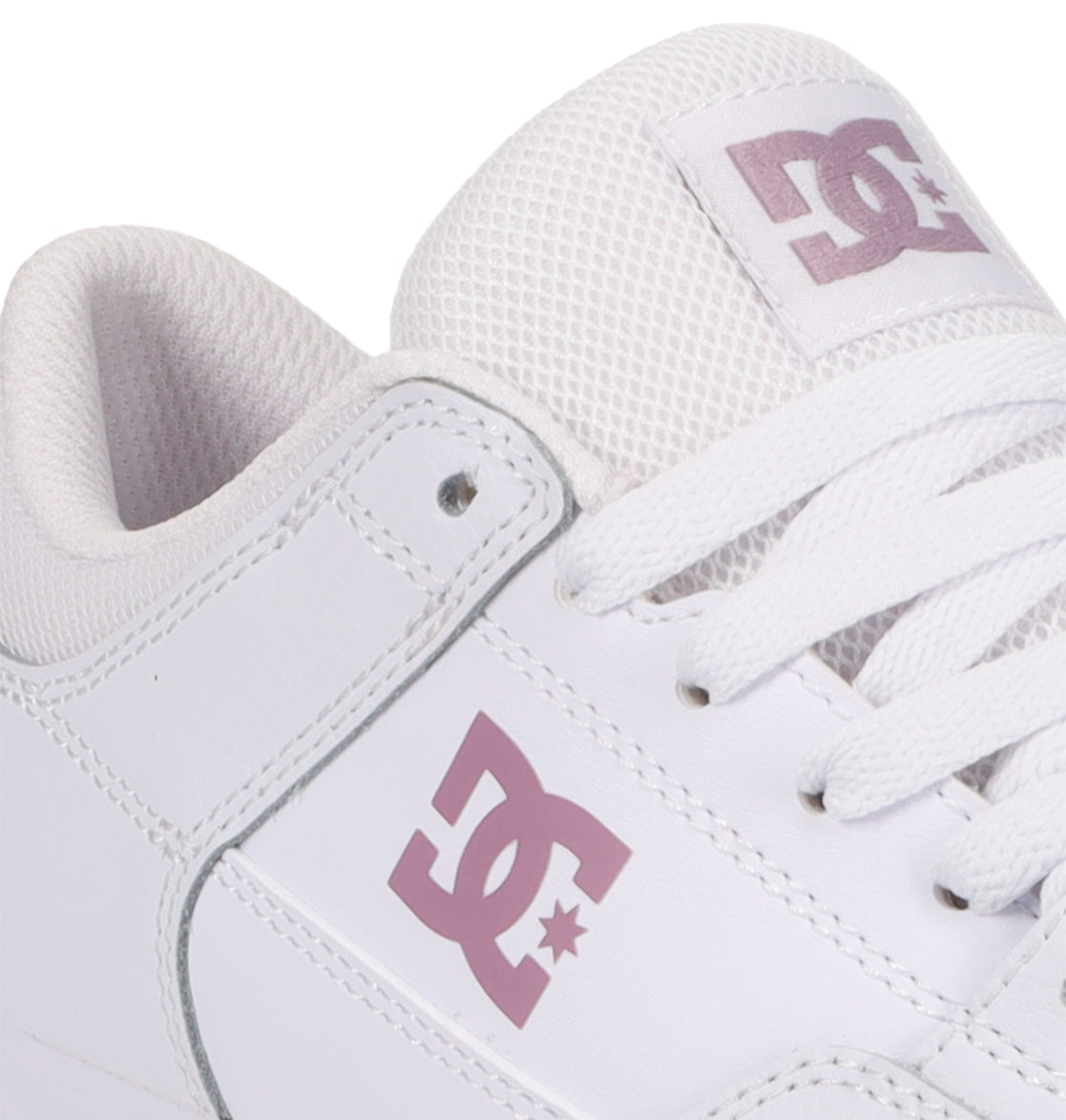 Close-up of the Women’s Onyx Shoes by DC Shoes, showcasing a minimal white silhouette with the DC Shoes logo in light purple on the side and tongue. Featuring white laces and a mesh-textured tongue, these sleek sneakers are an effortless everyday go-to.