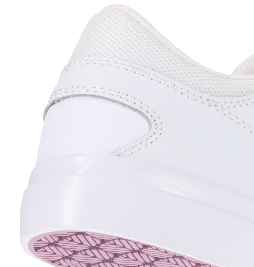 Close-up of the heel and sole of the Women’s Onyx Shoes by DC Shoes, featuring a white vulc sneaker design with a pink patterned tread that highlights the stitching and texture details. This minimal silhouette from DC Shoes makes it an ideal everyday go-to choice.