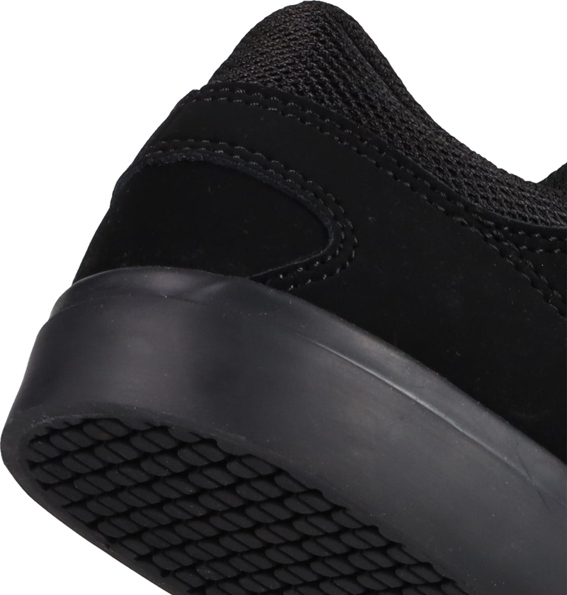 Close-up of the heel and sole of the Kids' Onyx Shoes by DC Shoes—everyday essentials with a minimal silhouette, textured rubber outsole, and suede upper.