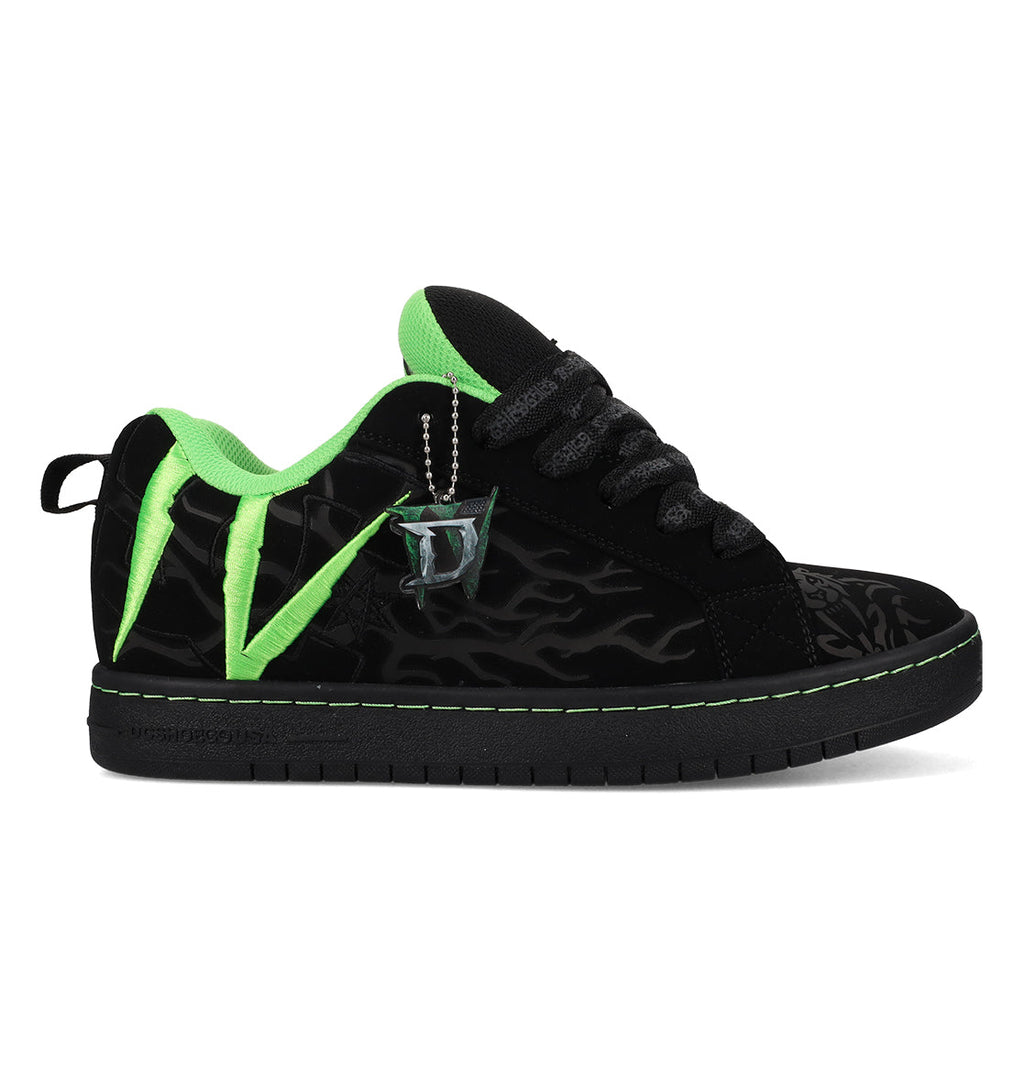 The Men’s Court Graffik x Diablo by DC Shoes is a black sneaker with neon green accents, flame patterns, thick black laces, and a silver drink cup keychain. It features a low profile and flat sole.