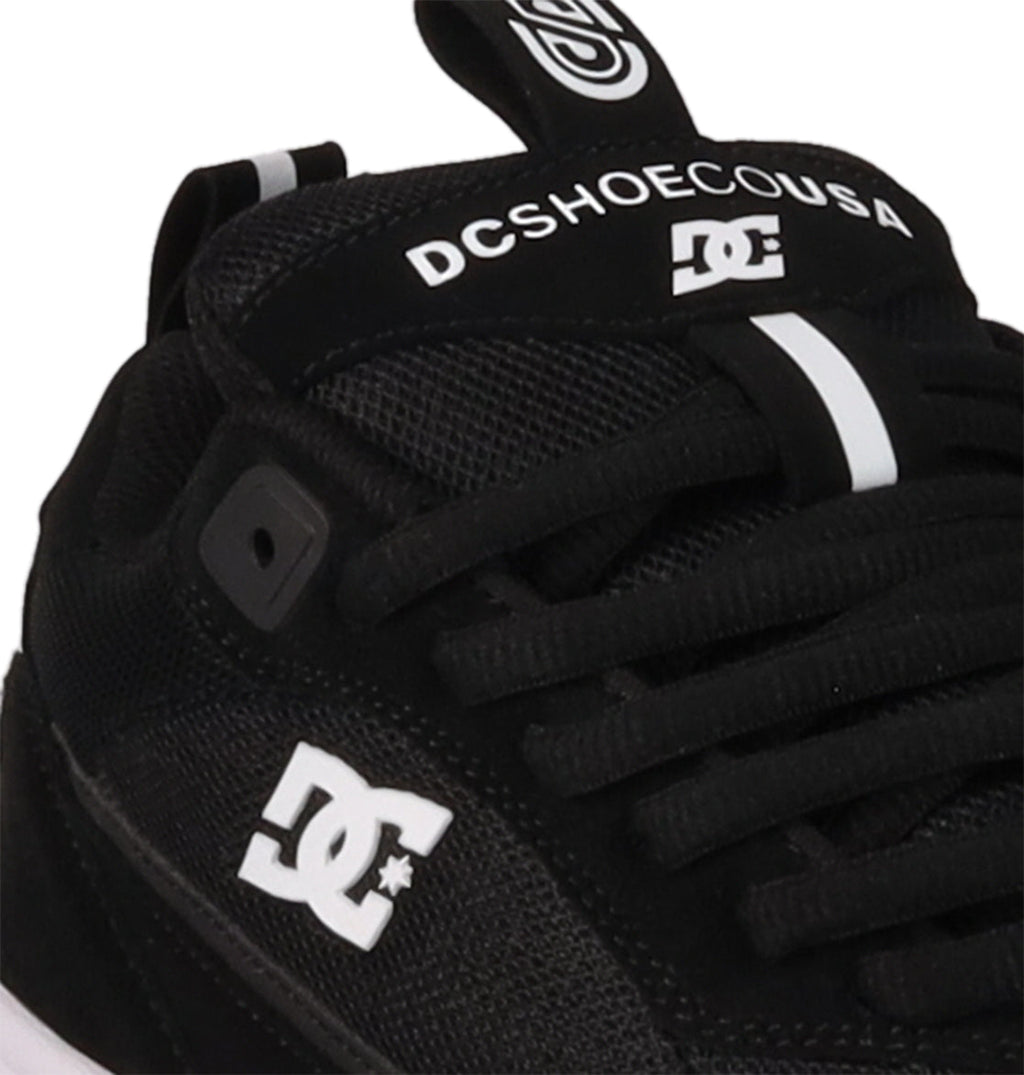 Close-up of the Men's JS-2 Shanahan Pro Skate Shoe by DC Shoes, showcasing the classic DC logo on the side, JS 2 branding for John Shanahan on the tongue, and black laces with a white stripe accent.