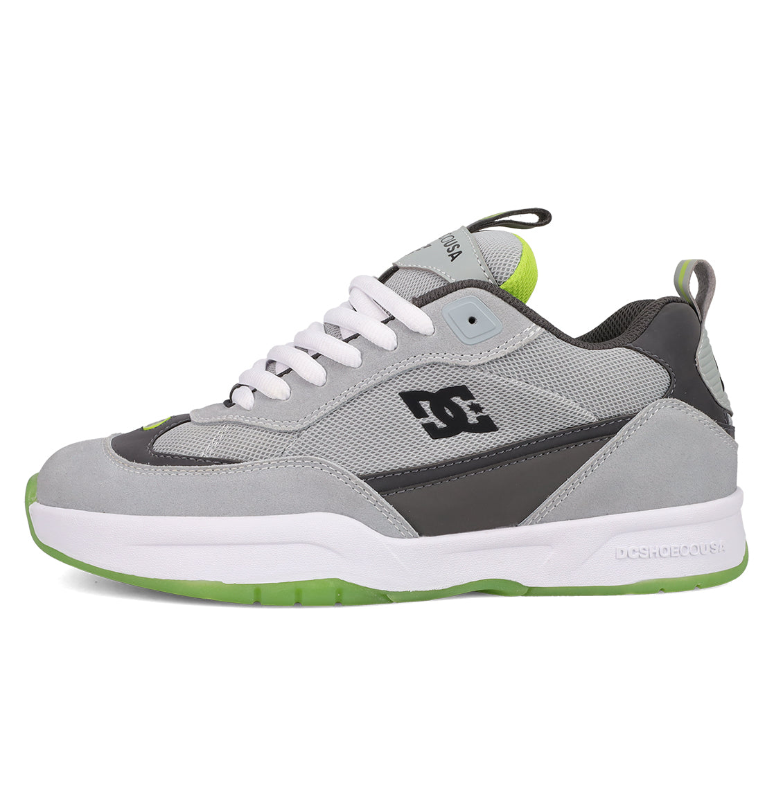 The Men's JS 2 Shoes by DC Shoes are gray and black skate shoes featuring white laces, a white and green sole, green accents, and the DC logo. Shown in side profile on a white background.