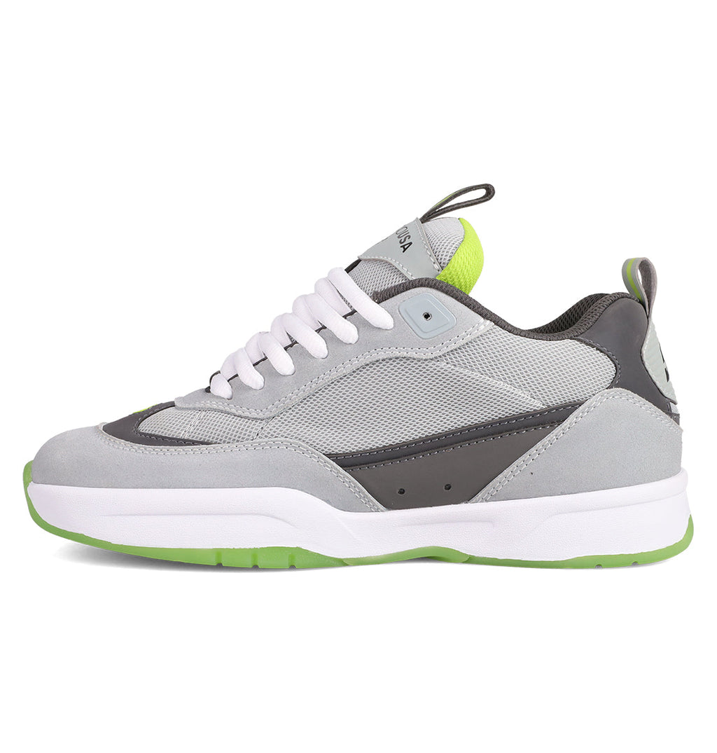 The Men's JS 2 Shoes by DC Shoes blend gray and white suede and mesh with green accents on the heel, tongue, and sole. Featuring white laces, they're inspired by DC heritage and designed with John Shanahan for the JS 2 collection.