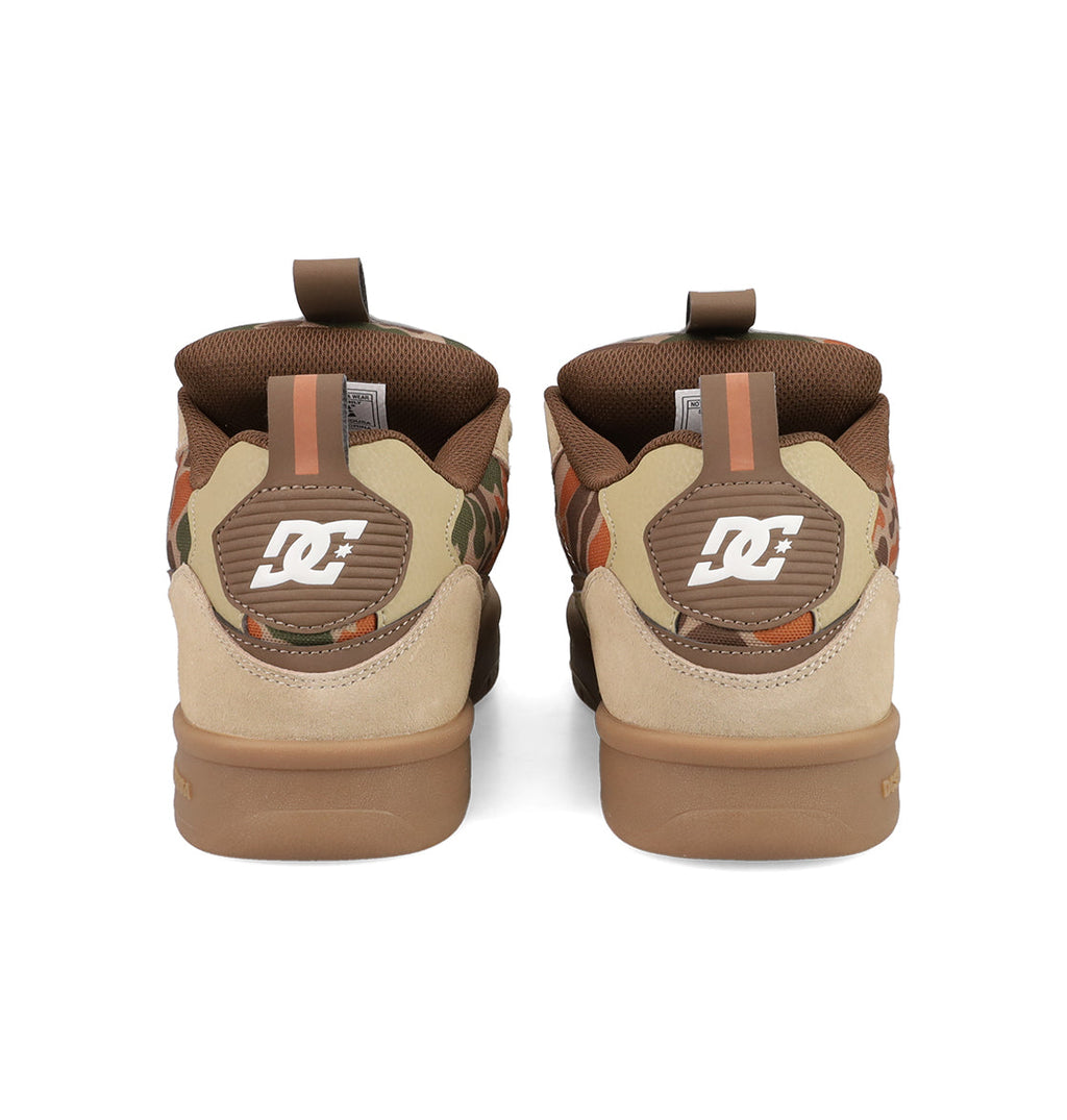 Back view of Men's JS 2 Shoes by DC Shoes, inspired by John Shanahan and DC heritage. Features beige suede, brown accents, side camouflage print, and white DC logo on the heels. Shown side by side against a white background.