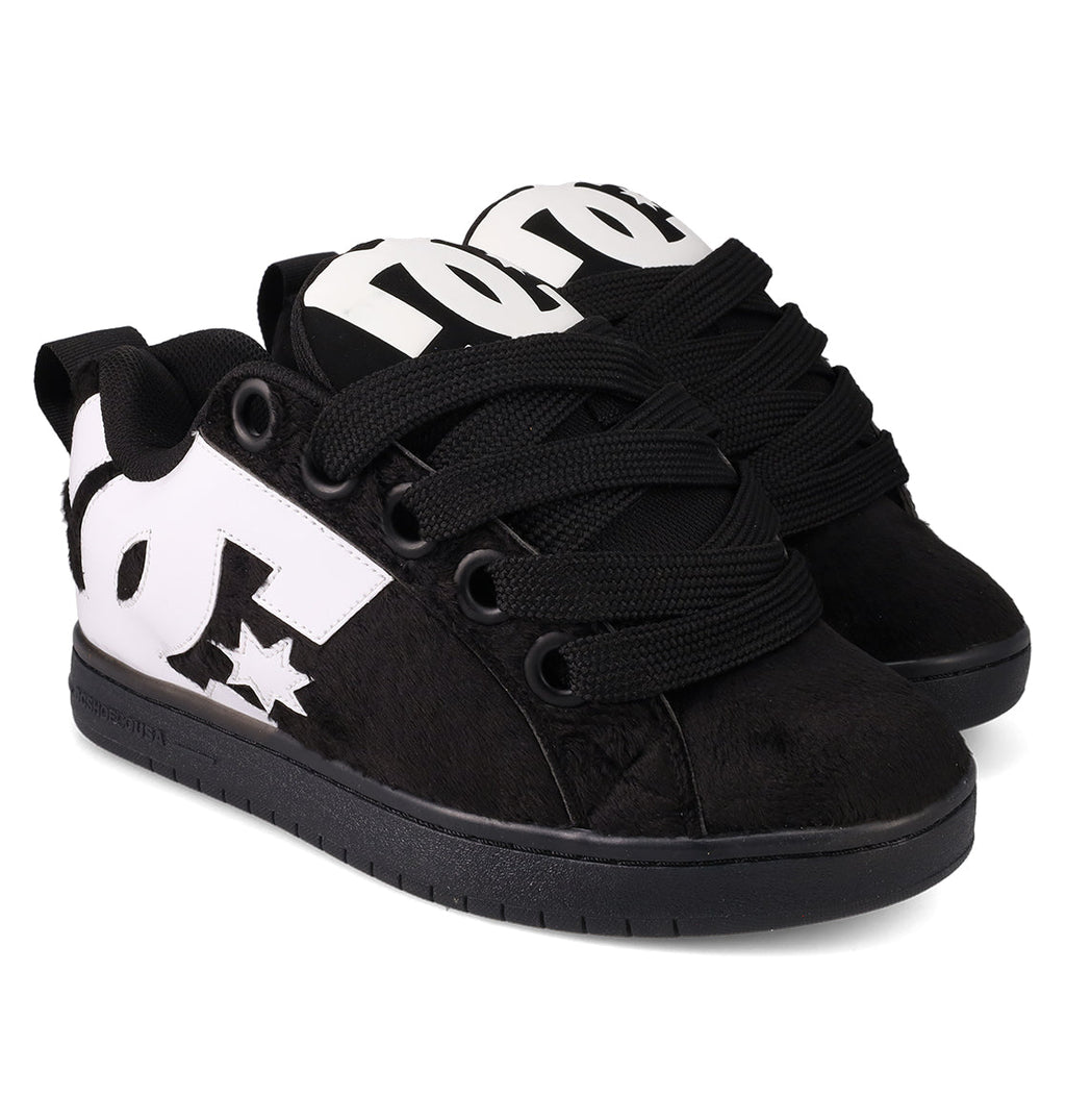 The DC Shoes Men's Court Graffik Puff Shoes are black, low-top skate shoes with a puffy silhouette, thick black laces, white DC logos on the sides, a textured finish, and flat black soles.