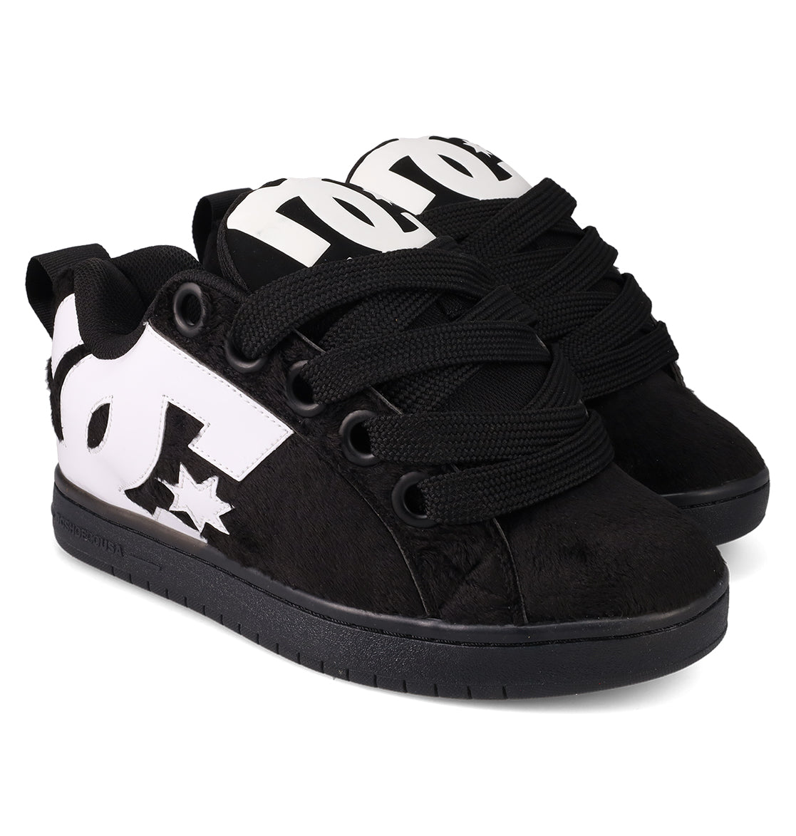 The DC Shoes Men's Court Graffik Puff Shoes are black, low-top skate shoes with a puffy silhouette, thick black laces, white DC logos on the sides, a textured finish, and flat black soles.