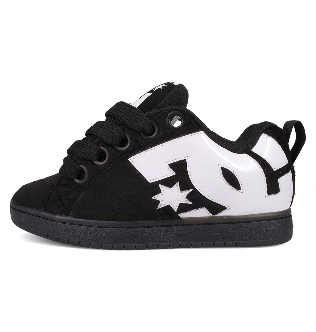 The Men's Court Graffik Puff Shoes by DC Shoes feature a puffy black silhouette, thick black laces, a bold white DC logo with star on the side, an exaggerated upper, and a black sole. Photographed on a plain white background.