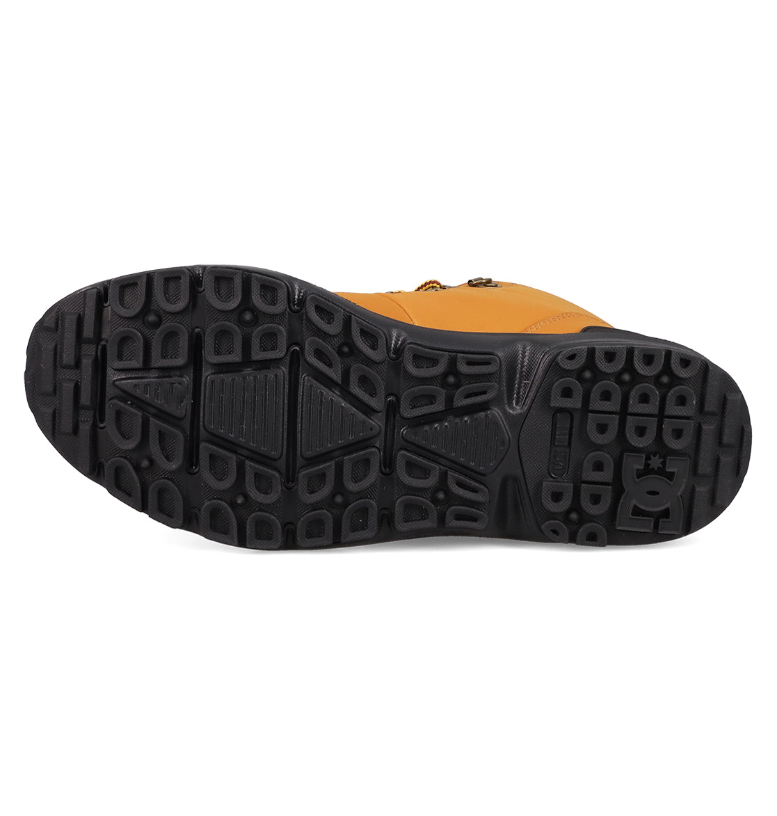 Close-up view of the black rubber sole on Men's DC Tarmont Shoes by DC Shoes, featuring a textured tread for all-weather traction and durability. The DC Shoes logo appears on the heel of the tan outdoor boot.