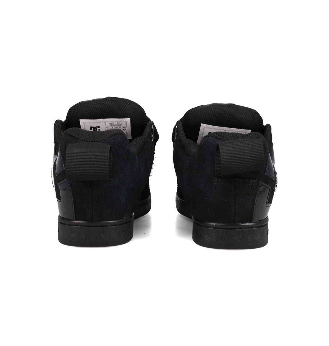 A pair of DC Shoes Women's Court Graffik Puff sneakers in black are shown from the back, side by side on a white background, with pull tabs and inner labels visible.