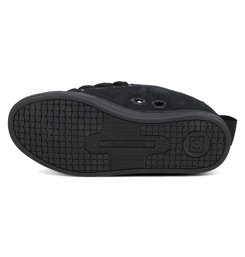 The image displays the sole of the DC Shoes Women's Court Graffik Puff Shoes, with a textured rubber grip, the DC logo embossed in the center, two metal eyelets, and part of its signature puffy upper silhouette.