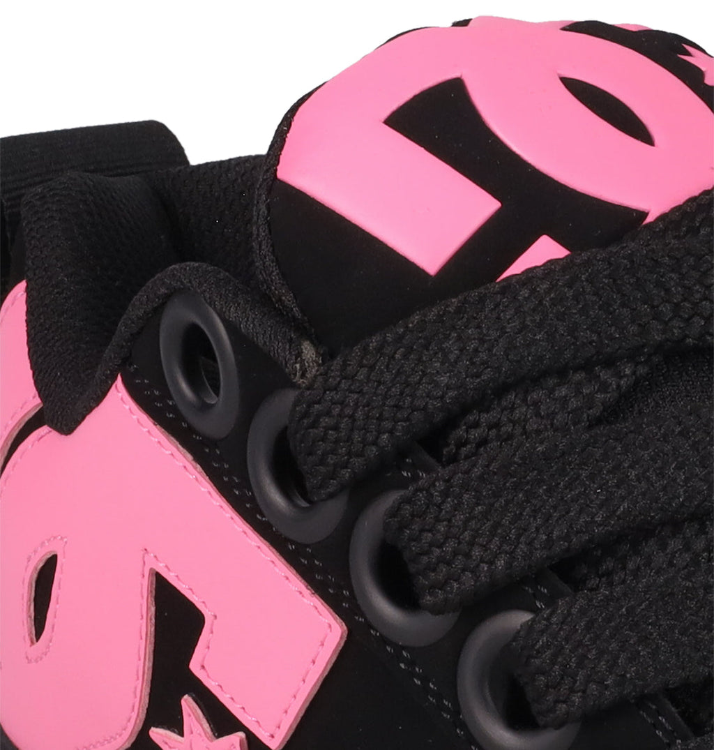 Close-up of DC Shoes Women's Court Graffik Puff with a black, puffy silhouette, thick black laces, and bold pink accents featuring a large stylized DC logo on the side and tongue.