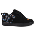 The Men’s Court Graffik Day Of The Dead skate shoe from DC Shoes features a sleek black design with matching laces and sole, accented by vibrant blue, orange, and white patterned details on the heel and side inspired by Día de los Muertos. An orange DC Shoes logo is showcased on the tongue and near the toe.