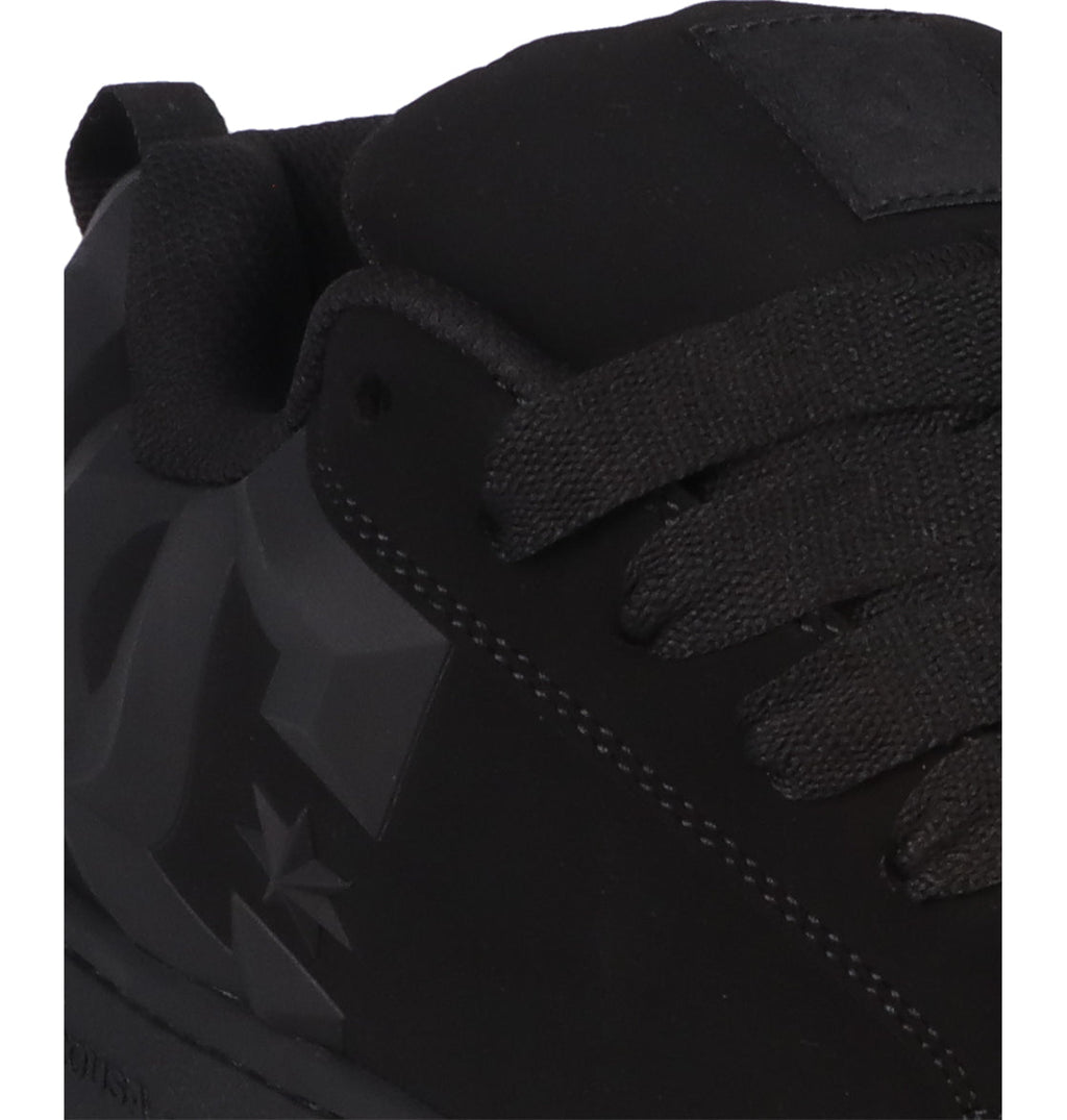 Close-up of the Men’s Court Graffik Beveled Shoes by DC Shoes, highlighting their signature puffy silhouette with thick black laces and a prominent beveled DC logo on the side, exemplifying bold DC branding.