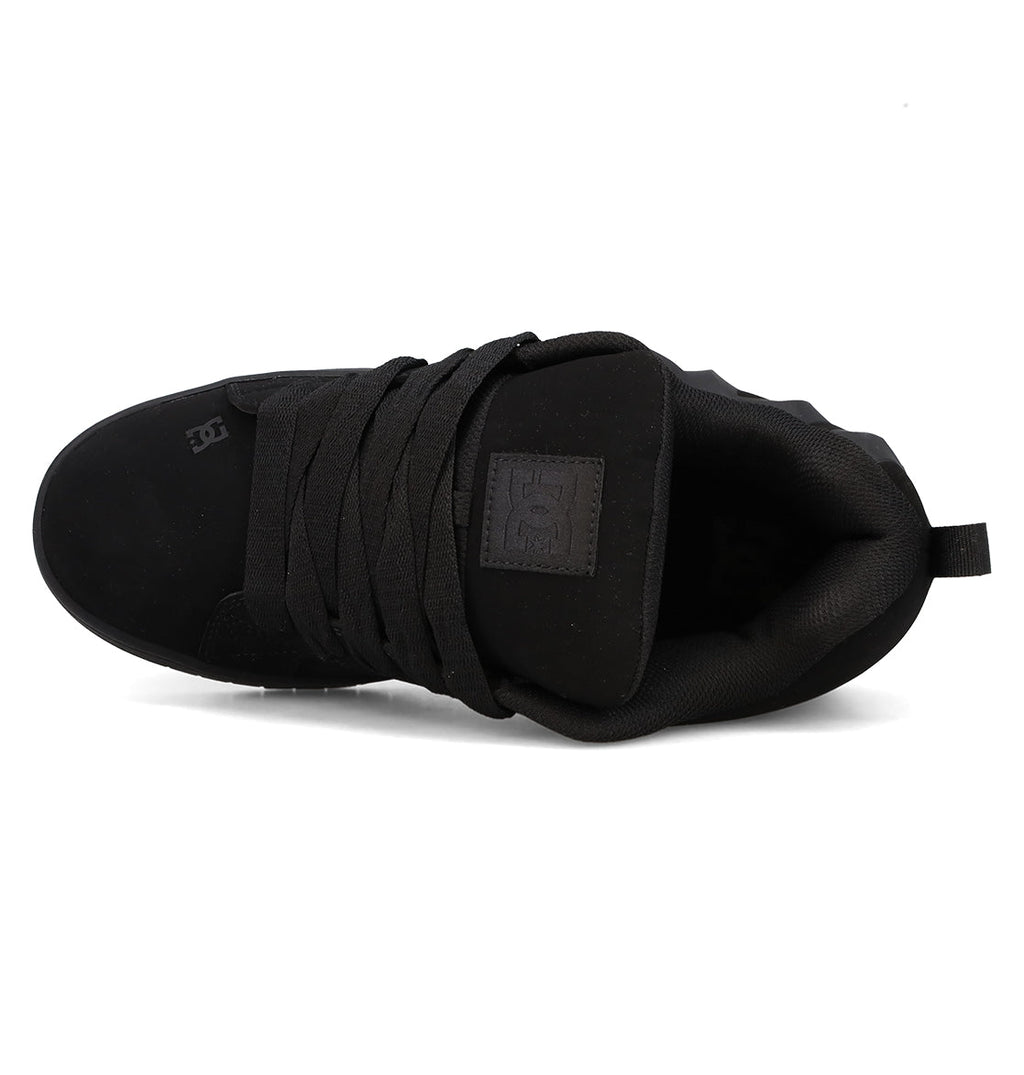 Top view of the DC Shoes Men’s Court Graffik Beveled Shoes in black, featuring thick laces, a padded collar, and a heel pull tab. The tongue and side showcase subtle embossed DC branding, while the shoe’s puffy silhouette and suede-like finish pay homage to the iconic Court Graffik Beveled style.