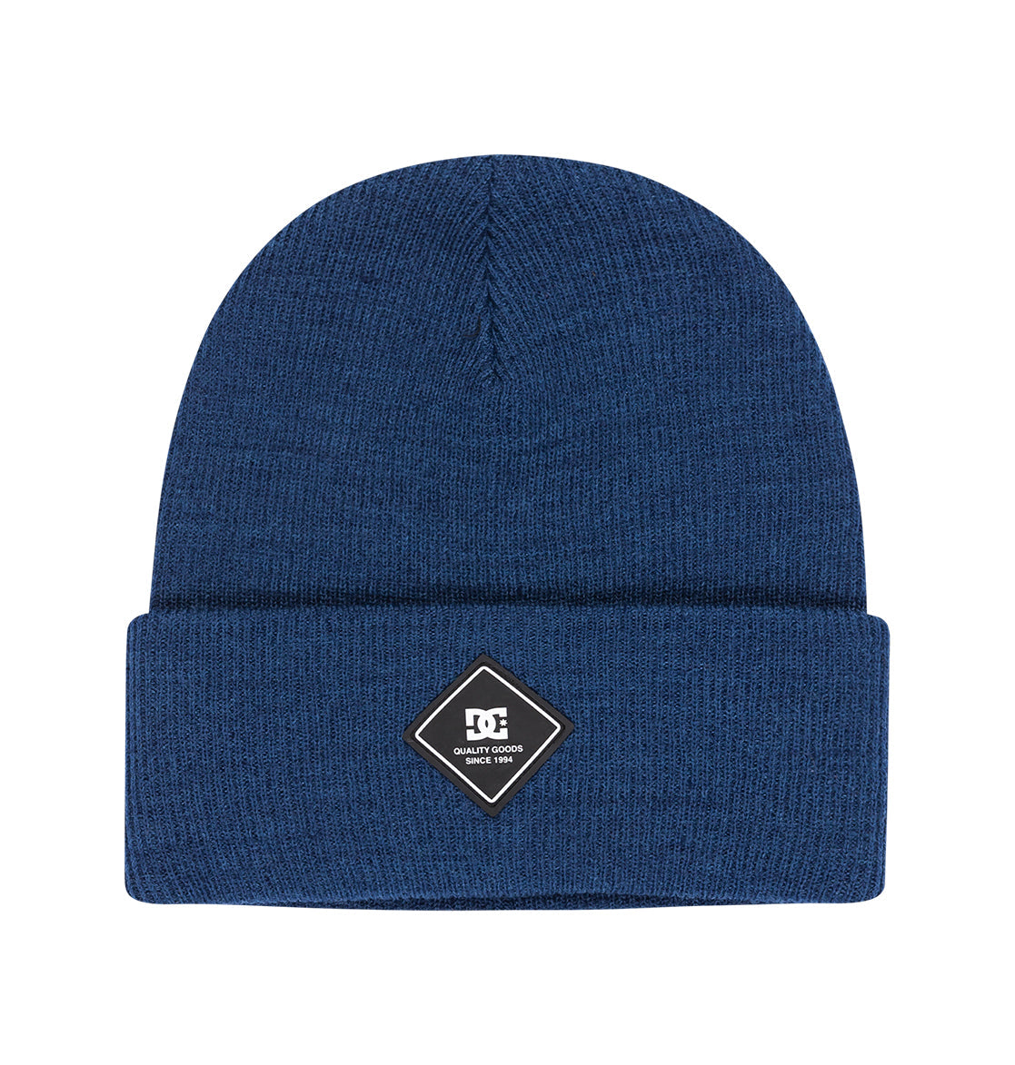 The Kids’ Label Beanie by DC Shoes is a blue knit beanie with a folded brim, featuring a black and white diamond-shaped patch on the front that displays the DC Shoes logo and the words “Quality Goods”—a perfect accessory for adding signature DC style to any outfit.