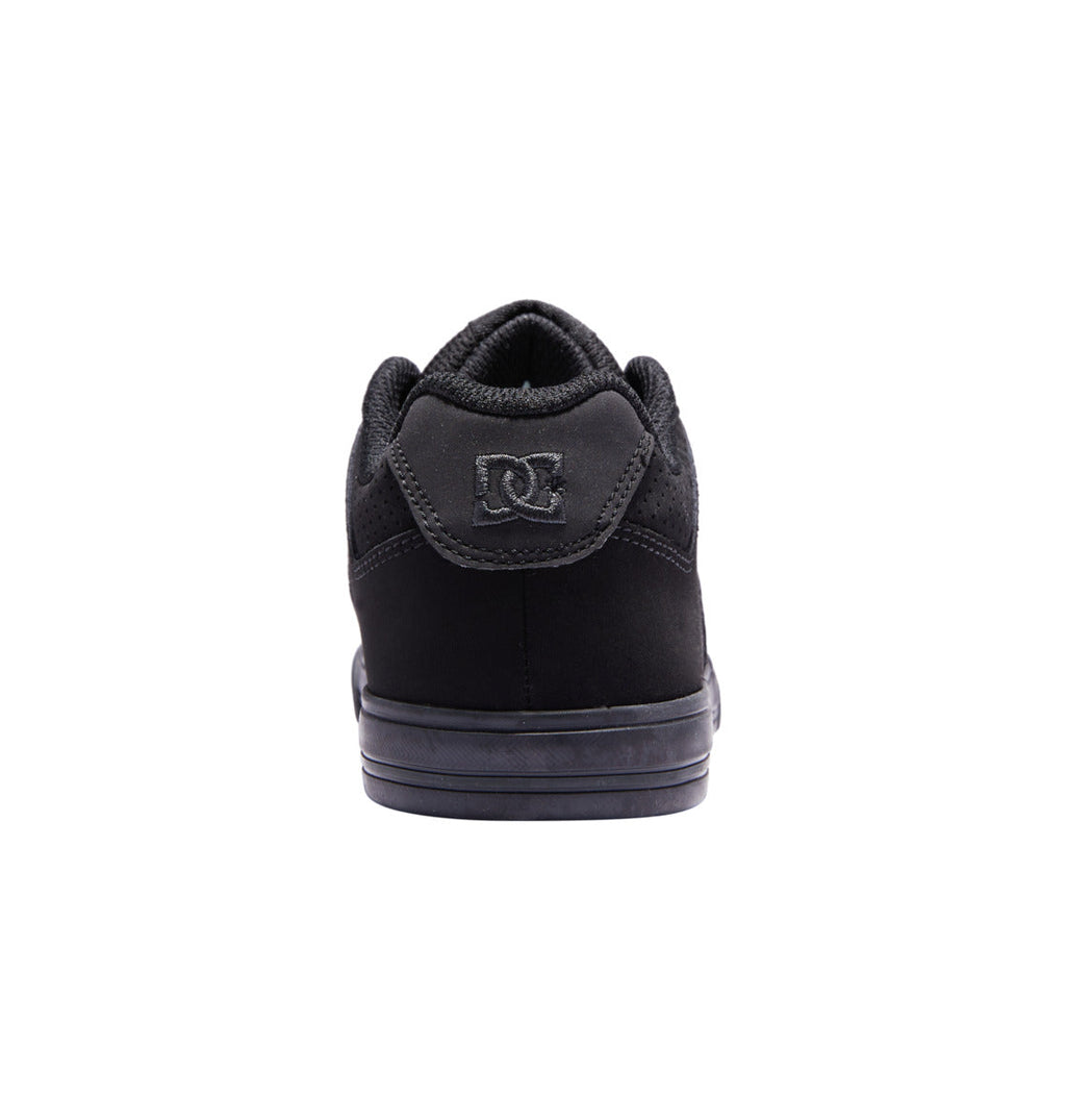 Back view of the Kids’ Pure Shoes by DC Shoes in black, featuring a DC logo on the heel, a black sole, and a padded collar—all set against a plain white background—making them an ideal choice for kids who need durable footwear with lasting comfort and signature style.