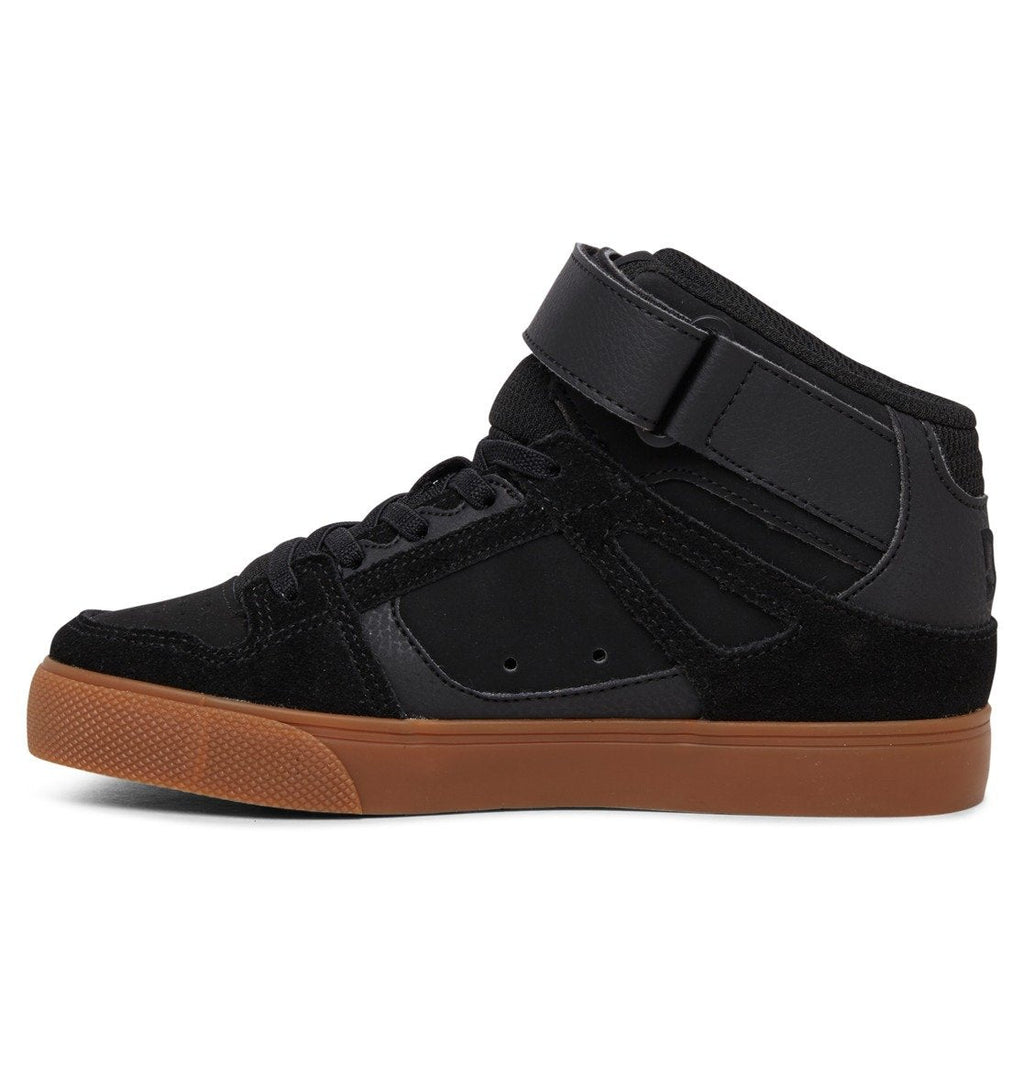 The DC Shoes Kids’ Pure High Elastic Lace High-Top Shoe is shown in a side view facing left against a white background, featuring a black colorway with an ankle strap, black laces, and a brown rubber sole.