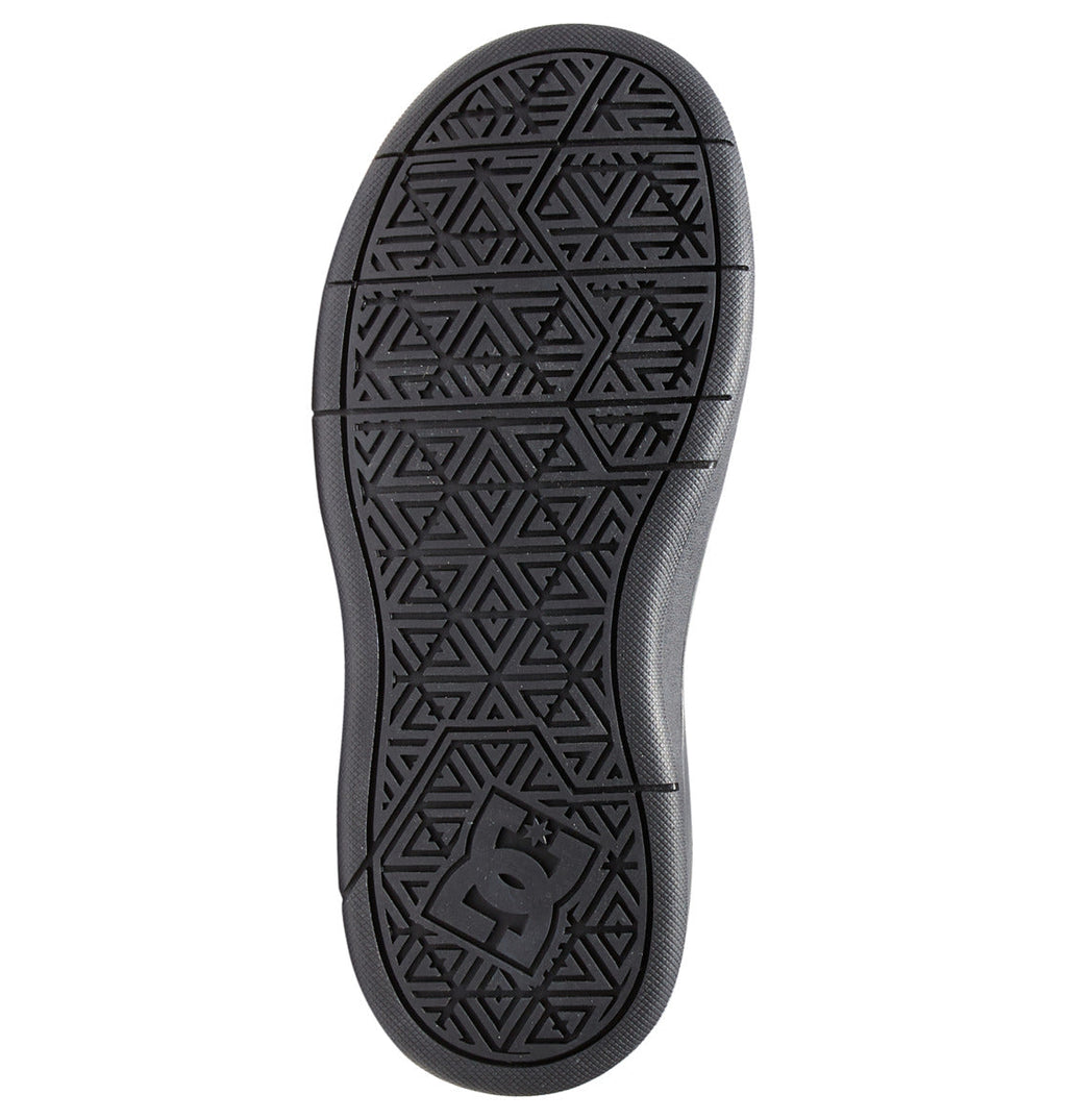The Kids’ Cure High-Top Shoes from DC Shoes feature a black sole adorned with geometric triangle patterns and lines, along with a raised DC logo near the heel. The textured tread design offers excellent grip and traction, making these affordable shoes from the DC Kids collection perfect for everyday wear.