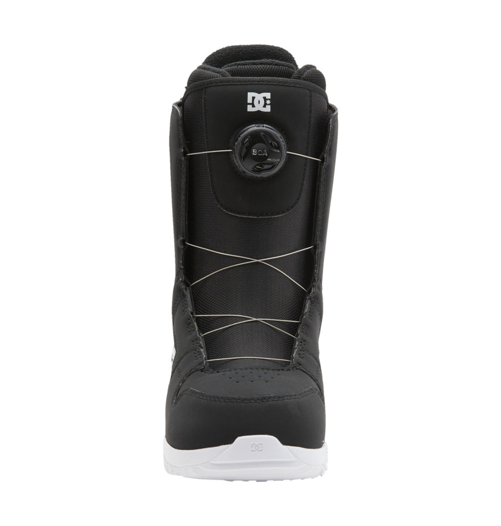 Front view of a black Women’s Phase BOA® Snowboard Boot by DC Shoes, featuring a white sole, silver lace system, and the DC logo on both the tongue and toe. The boot includes a round tightening dial on the front with the BOA® Fit System for precise adjustments—seamlessly merging style and function in this signature DC Shoes design.