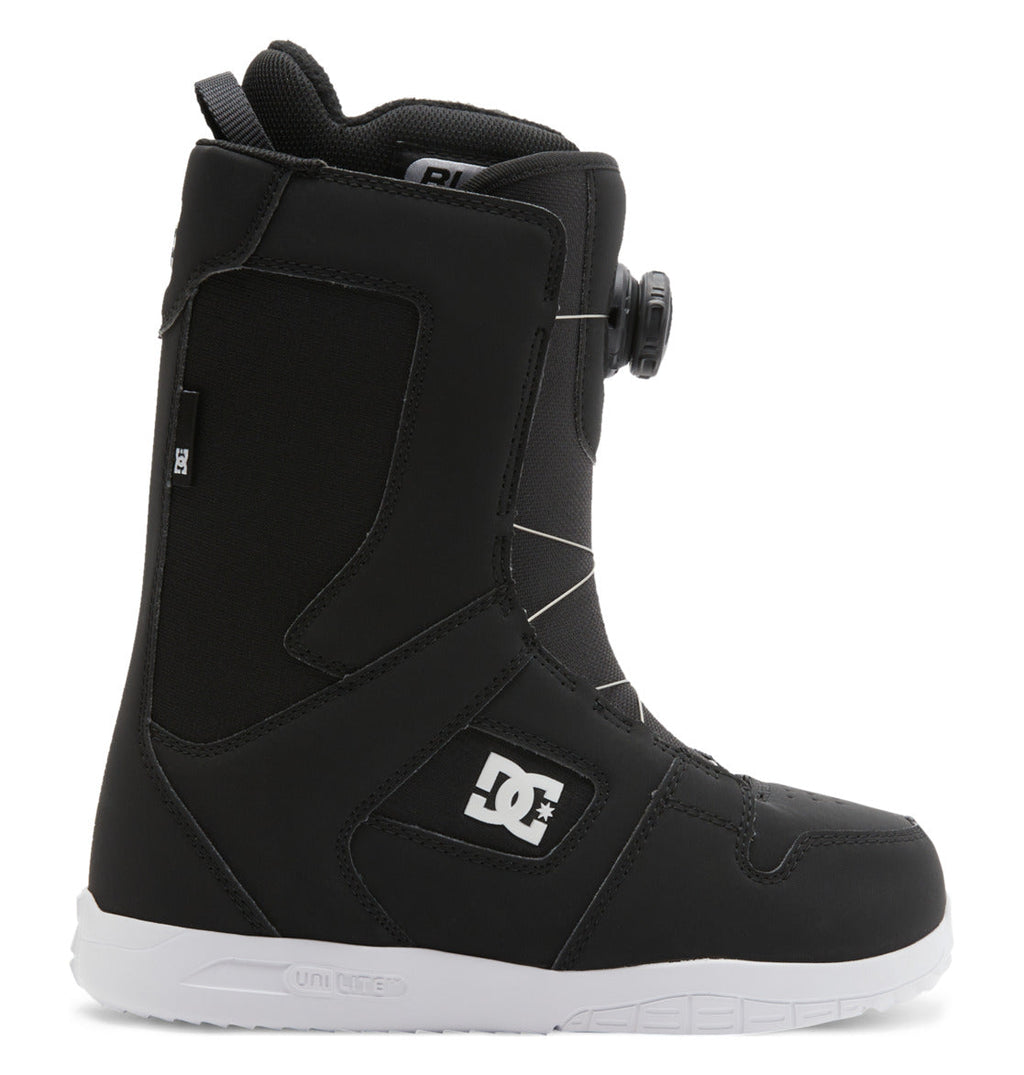 A black DC Shoes Women’s Phase BOA® Snowboard Boot is shown in profile facing right, with a white logo on the side, the BOA Fit System dial lacing, and a textured white sole.