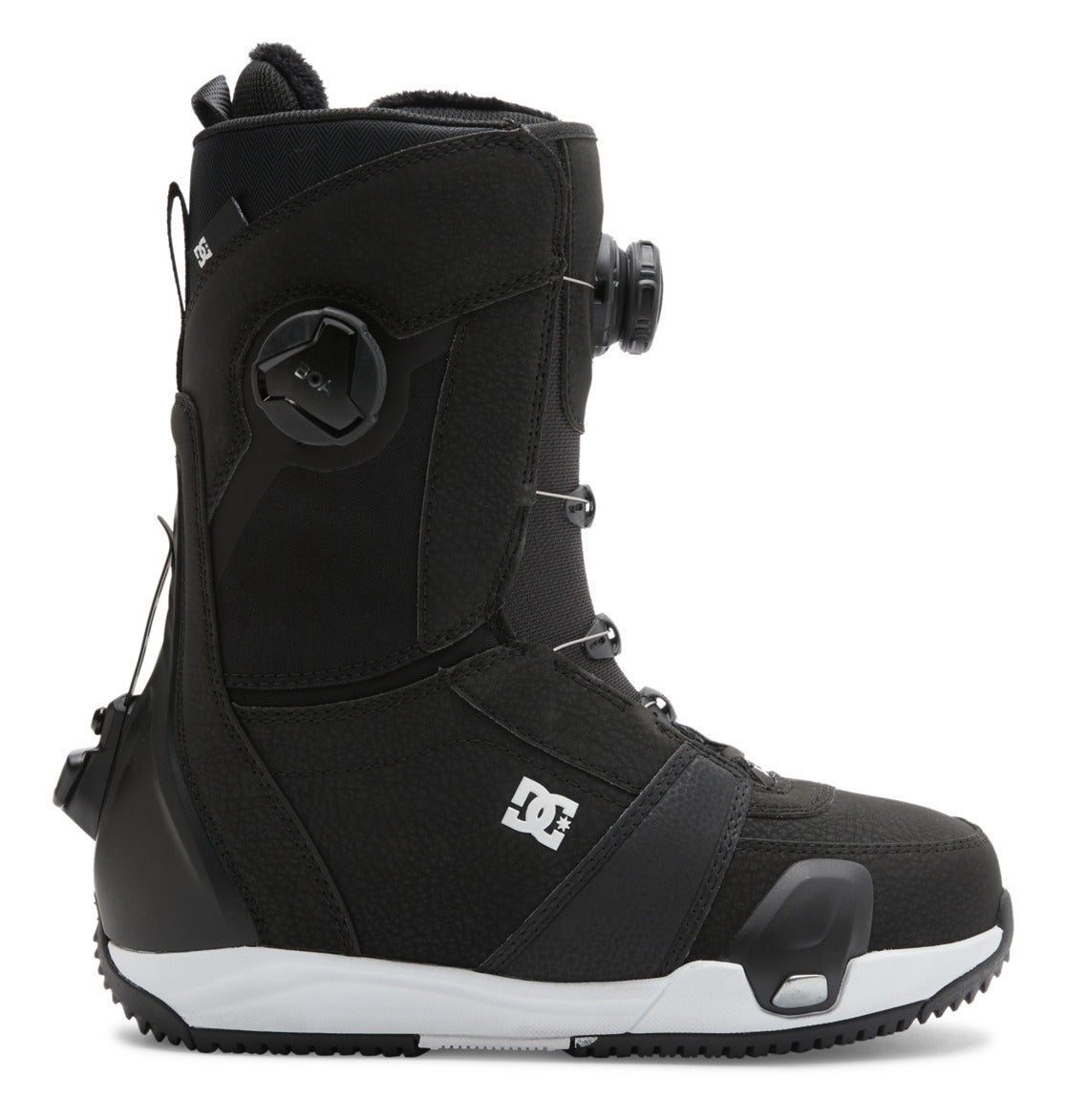 The DC Shoes Women’s Lotus Step On® Snowboard Boot in black with a white sole is shown from the left side view against a white background, featuring the Dual Zone BOA Fit System and displaying the DC logo on the side.