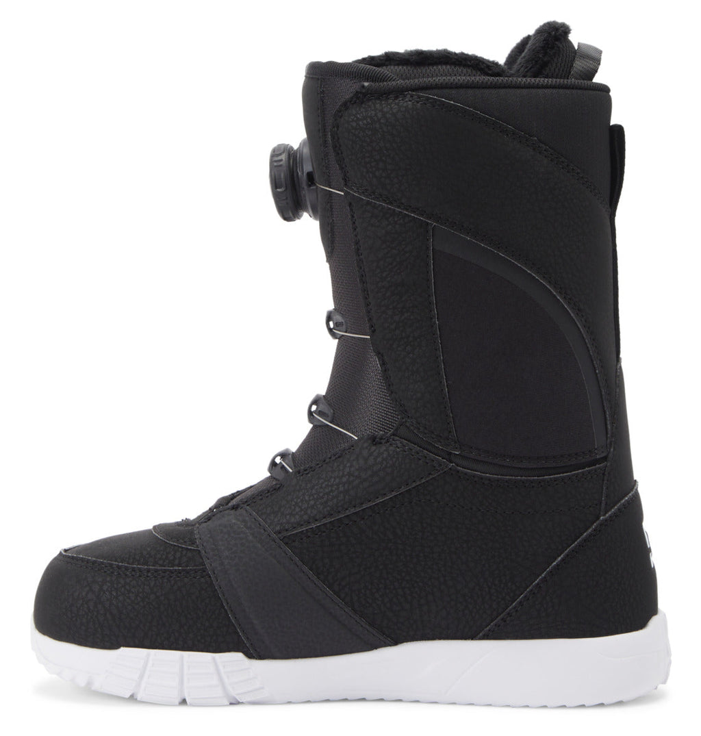 A single Women’s Lotus BOA® Snowboard Boot by DC Shoes in black, shown from the side with a white UNILITE outsole. The boot features a textured surface, ankle padding, and a Dual Zone BOA® Fit System dial lacing system on the front.