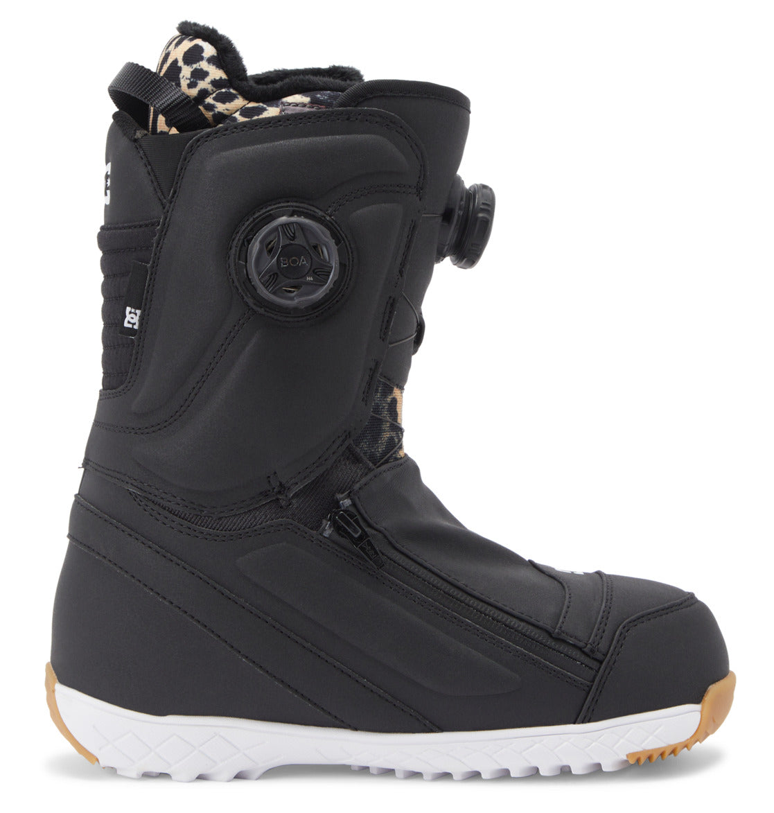 A side view of the DC Shoes Women’s Mora BOA® Snowboard Boot in black, showcasing a white sole, a black BOA Fit System dial closure, PrimaLoft insulation, and a leopard-print inner lining.
