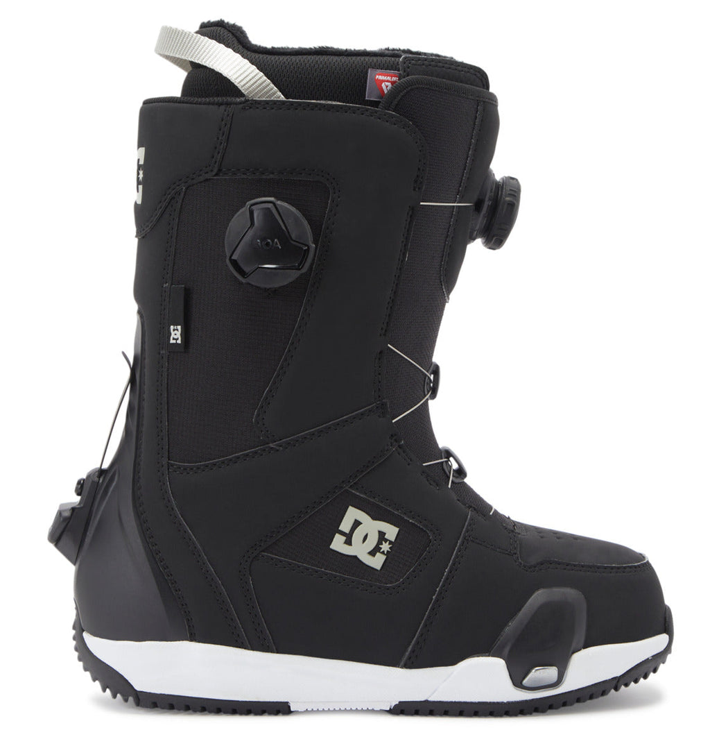 A left-profile view of the DC Shoes Women’s Phase Pro Step On BOA® Snowboard Boot in black with white accents, showcasing the BOA® Fit System tightening dials and DC Shoes logo on the side, set against a white background.