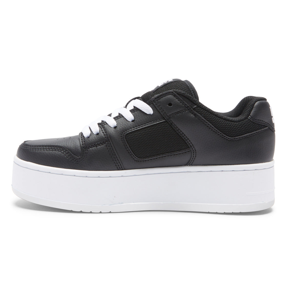 A side view of the Women’s Manteca 4 Platform Shoes by DC Shoes displays a black sneaker with white laces and a thick white platform sole, set against a plain white background and combining modern style with comfort for women.