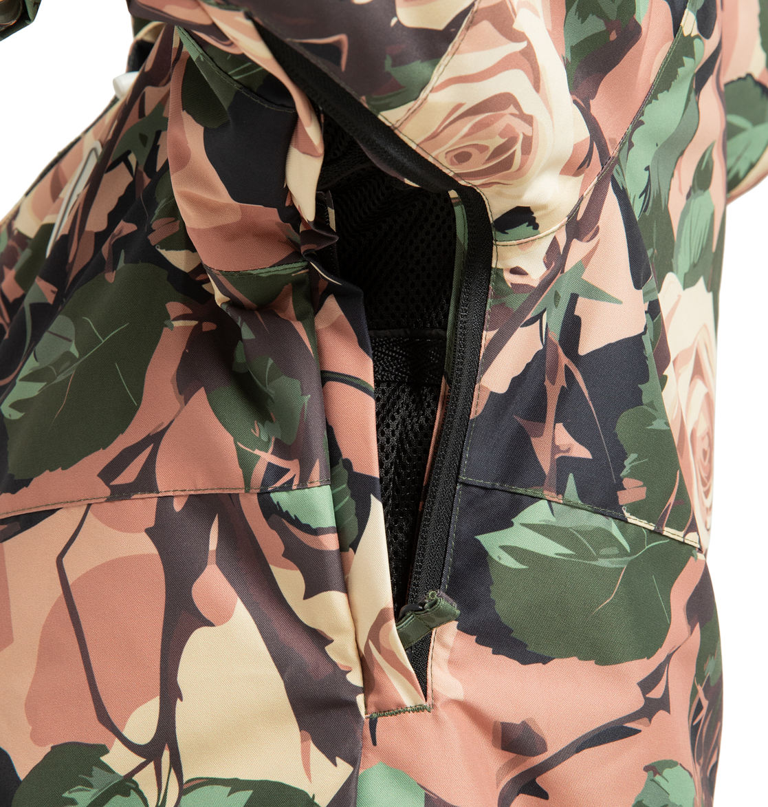 A close-up of the DC Shoes Women’s Cruiser Insulated Snow Jacket displays an unzipped vent lined with black mesh fabric, revealing part of the insulated interior made from recycled polyester.