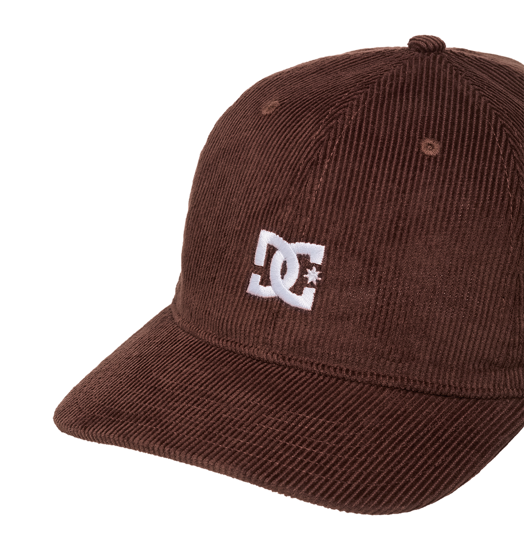The Men's DC Cap Star Strapback by DC Shoes is a brown corduroy skate cap with a curved brim and white embroidered DC logo on the front, displayed against a plain white background.