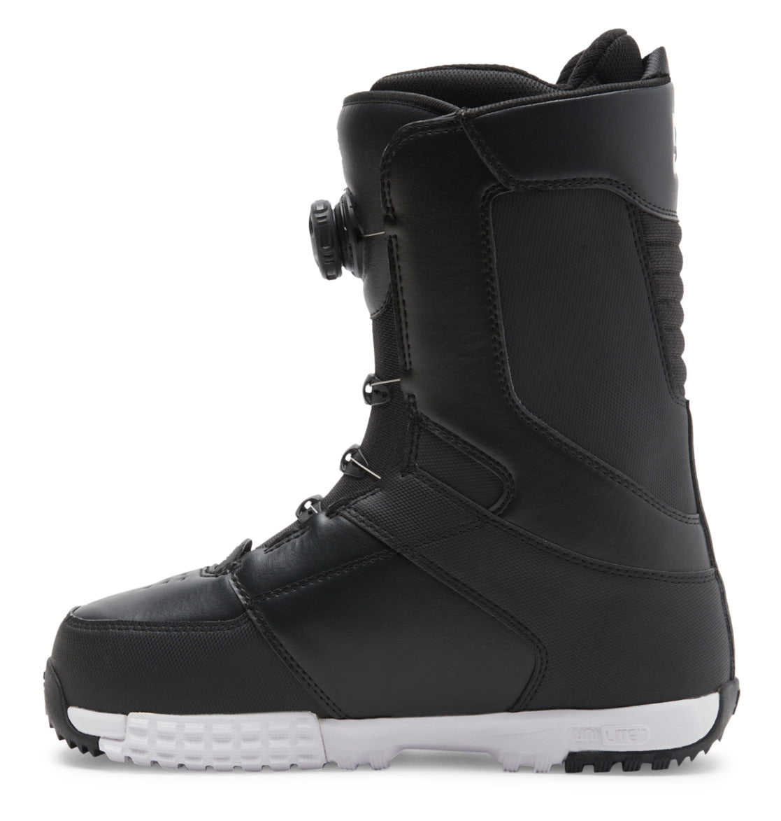 The Men’s Control BOA® Snowboard Boot by DC Shoes is shown in a left side profile against a white background. This black all-mountain boot features a contrasting white sole, thick stitching along the seams, and a side dial from the Dual Zone BOA Fit System for precision tightening.