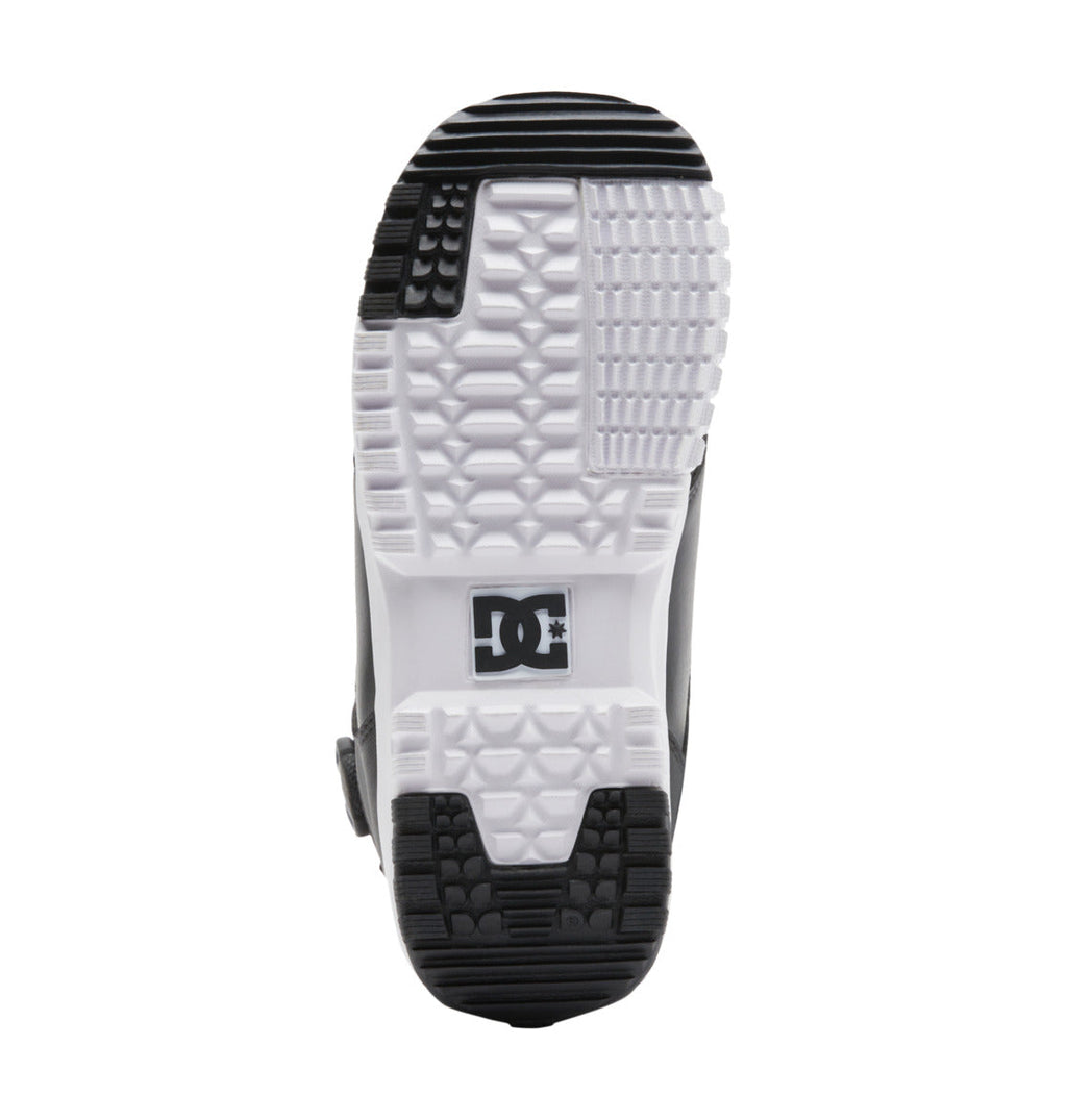 The sole of the Men’s Control BOA® Snowboard Boots by DC Shoes, shown from the bottom, highlights a textured grip pattern inspired by classic skate footwear and features the DC logo at the center.